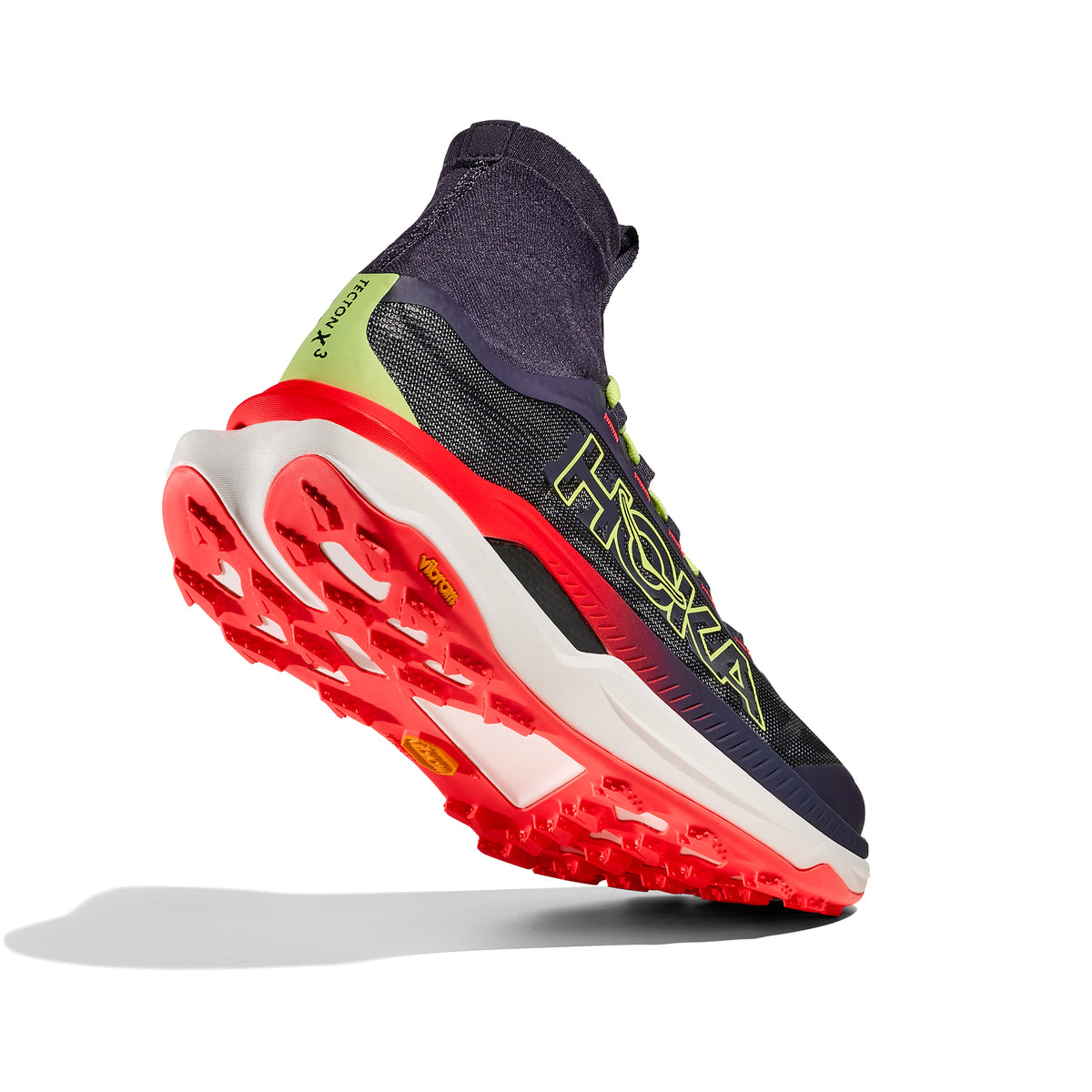 HOKA Tecton X 3 men's trail running shoe in Squid Ink / Neon Flame — angled side view showing squid ink Matryx® textile upper, patent-pending carbon fibre plate profile, MetaRocker™ geometry and neon flame dual-layer PEBA midsole stack
