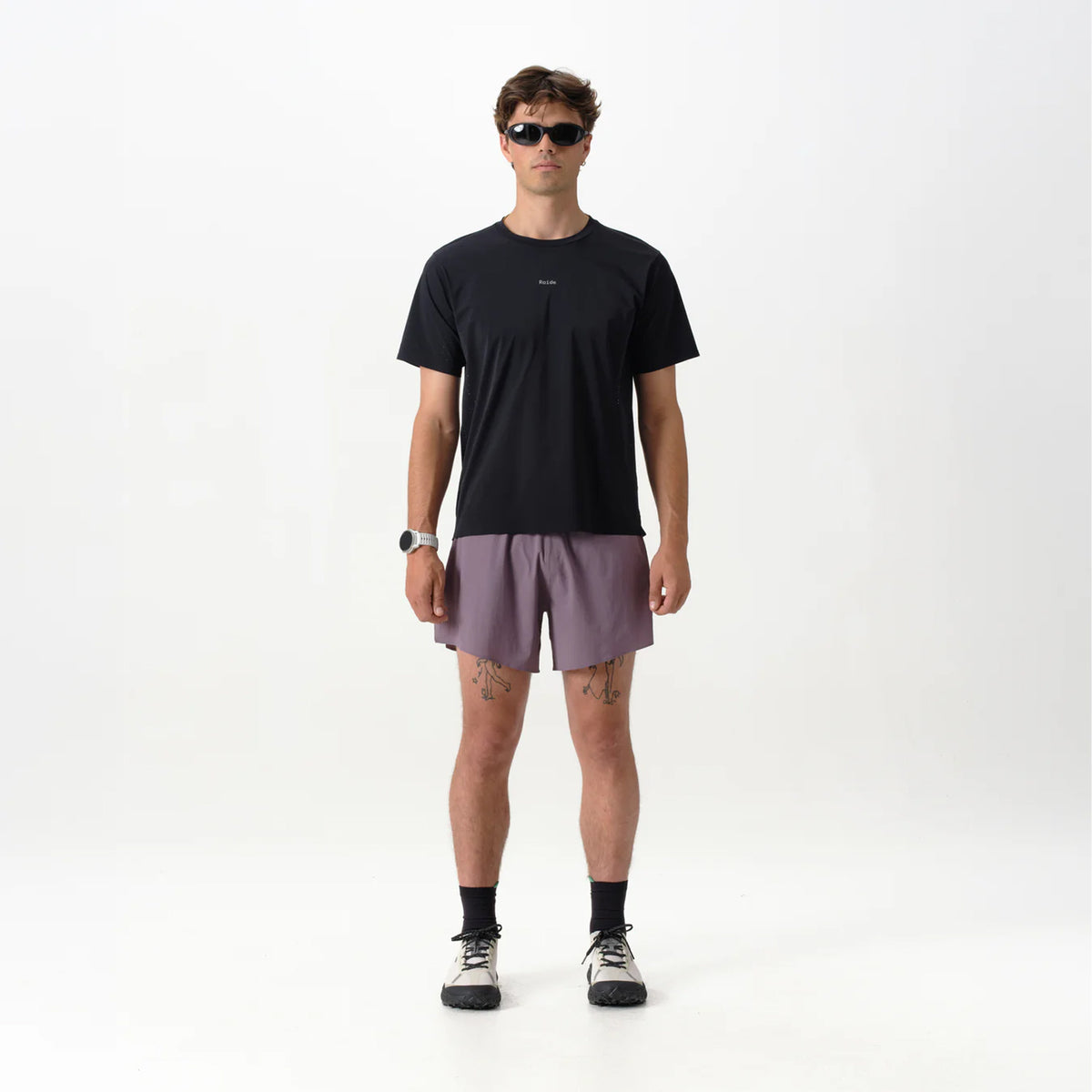 Men's Raide Thermal Dispersion Tee Black front full body view on male runner showing cool-to-touch Italian microfibre with four-way stretch and body-mapped perforations for lightweight warm weather training