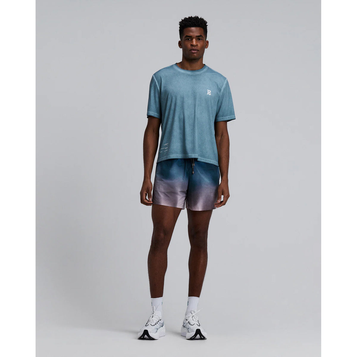 Bandit Vento™ 5 Inch Run Shorts men's in Flow State Aegean Multi — full body front view worn on model showing 5 inch silhouette, flow state aegean multi Vento™ four-way stretch fabric and custom branded drawstring waistband in motion