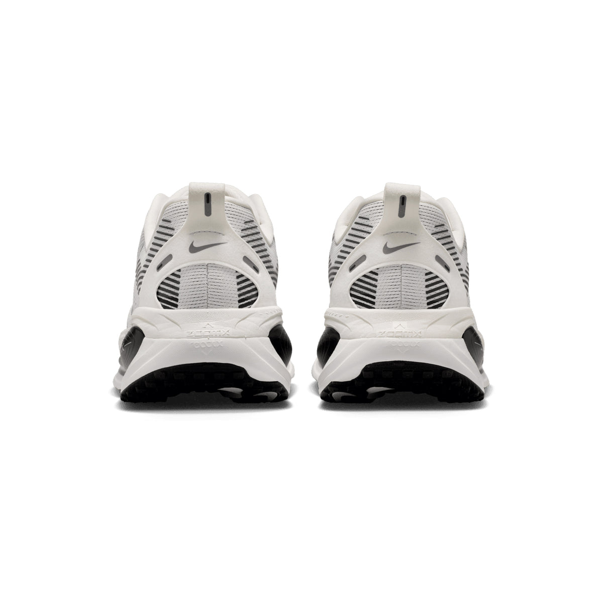 Nike Vomero 18 men's running shoe in Summit White / Black / Off White / Metallic Silver — heel view showing padded collar construction, black heel detailing and dual-density ZoomX ReactX midsole contrast