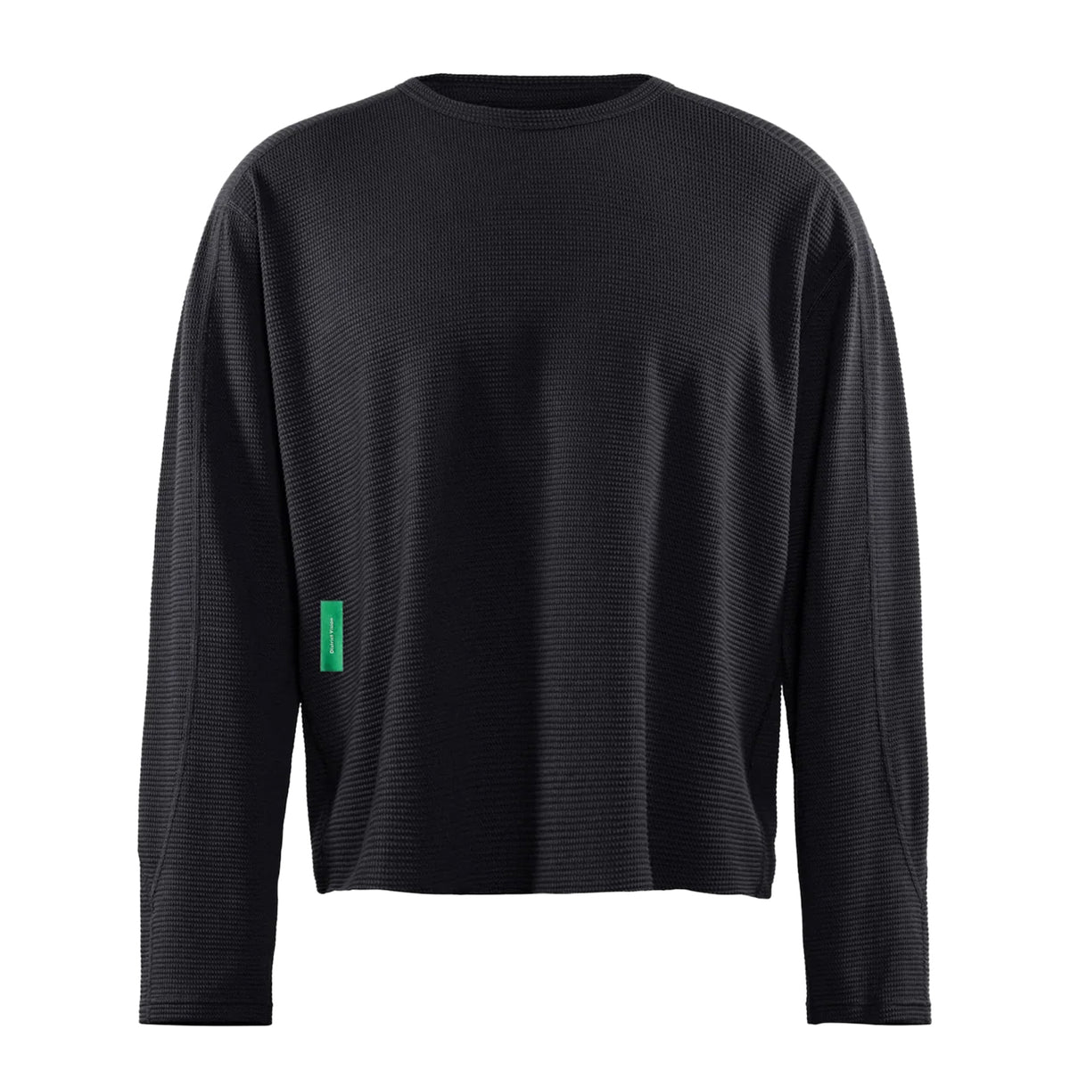 District Vision Men’s Waffle Top Black long-sleeve crewneck shirt in a textured waffle-knit with a small green rectangular tag on the side.