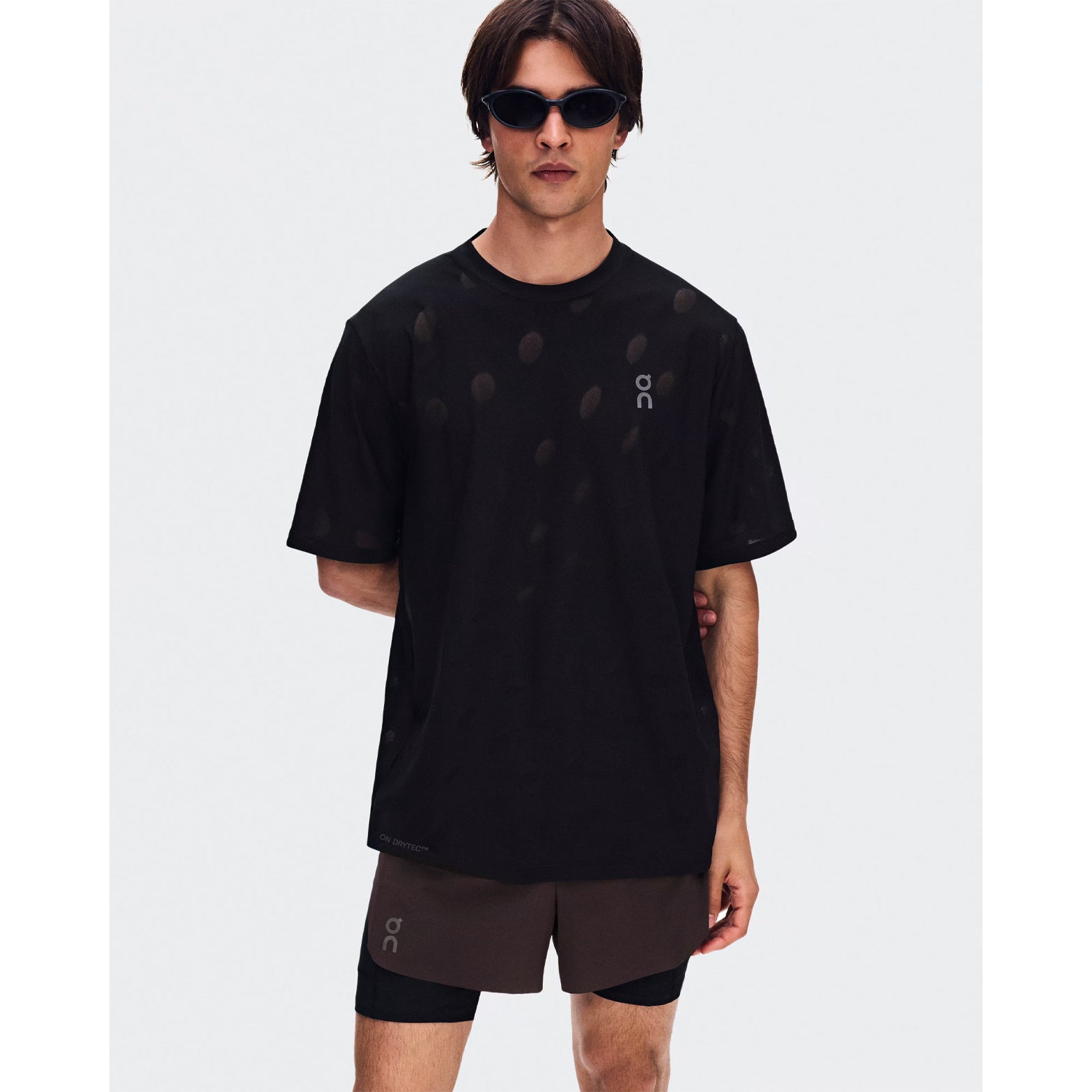 Men's On Zero-T Breathe Black front view on male runner showing ultralight DryTec breathable jacquard construction with distraction-free fit for training runs