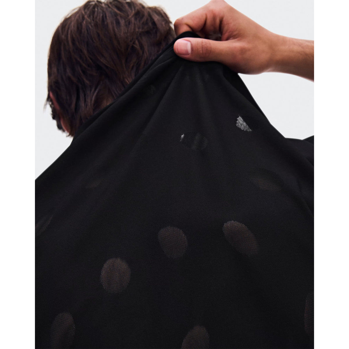 Men's On Zero-T Breathe Black close-up of distinctive functional jacquard fabric showing On DryTec breathable moisture-wicking construction for ultralight distraction-free training