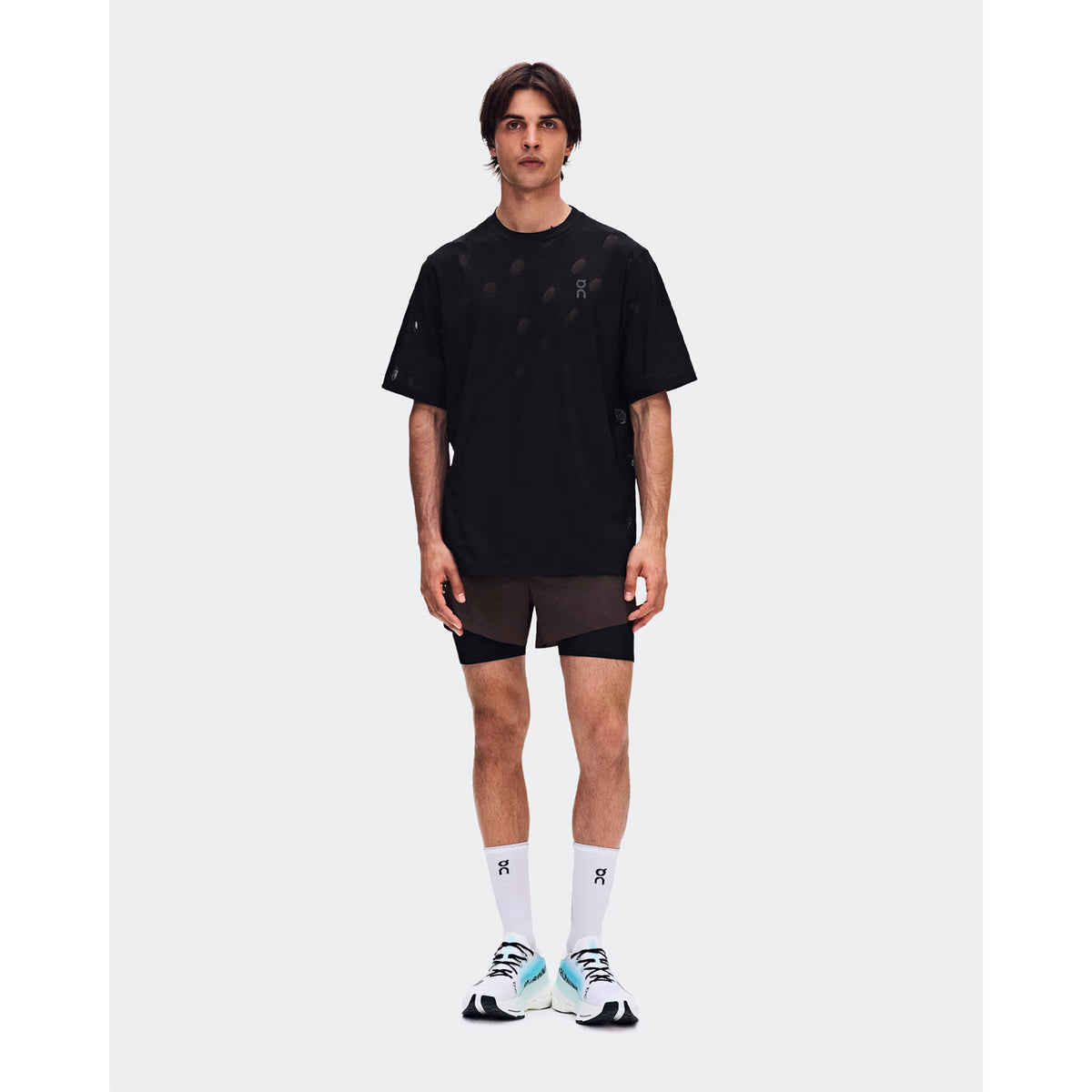 Men's On Zero-T Breathe Black front full body view on male runner showing ultralight OAC-inspired jacquard tee with DryTec breathable construction for comfortable training performance