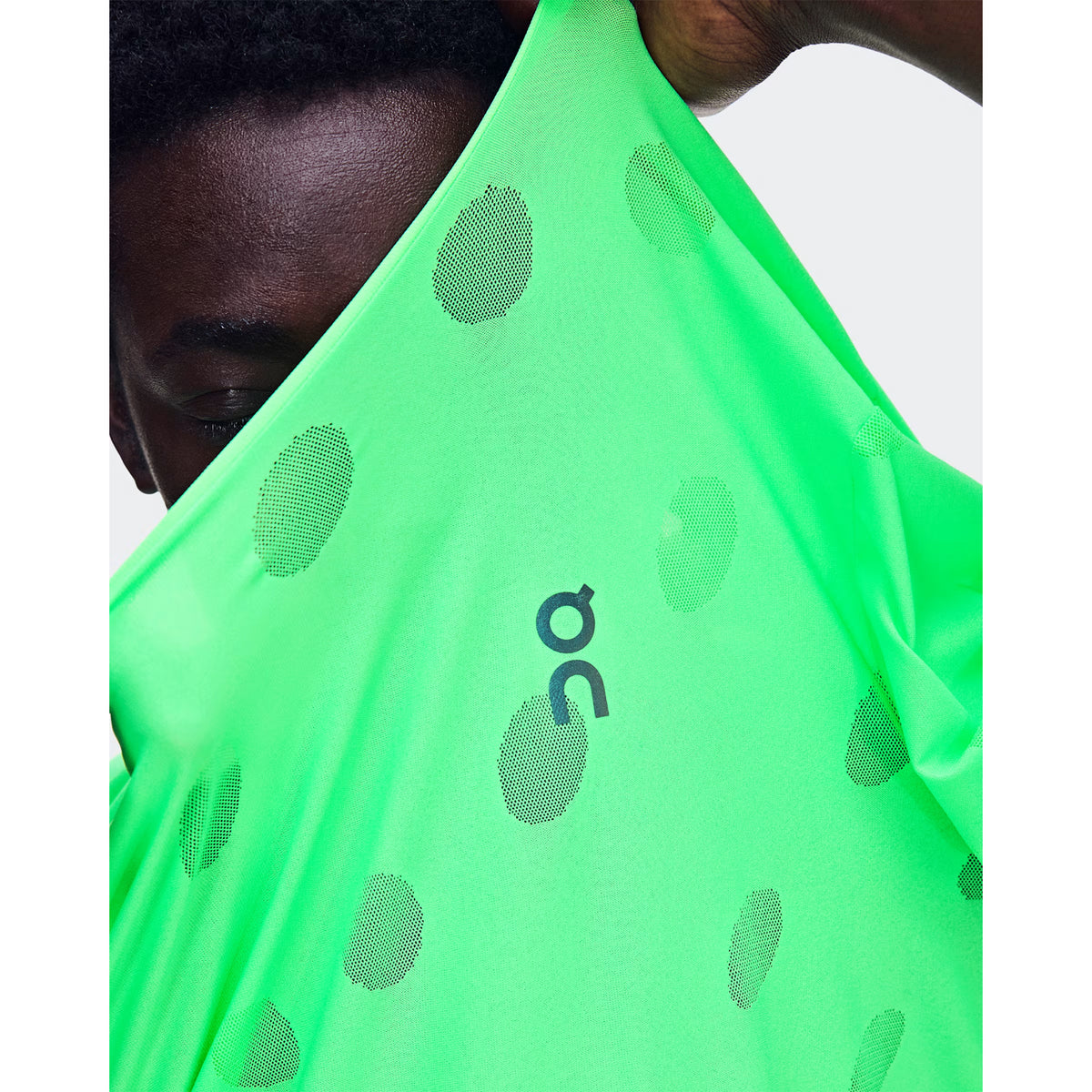Men's On Zero-T Breathe Verdite close-up of distinctive functional jacquard fabric showing On DryTec breathable moisture-wicking construction for ultralight distraction-free training