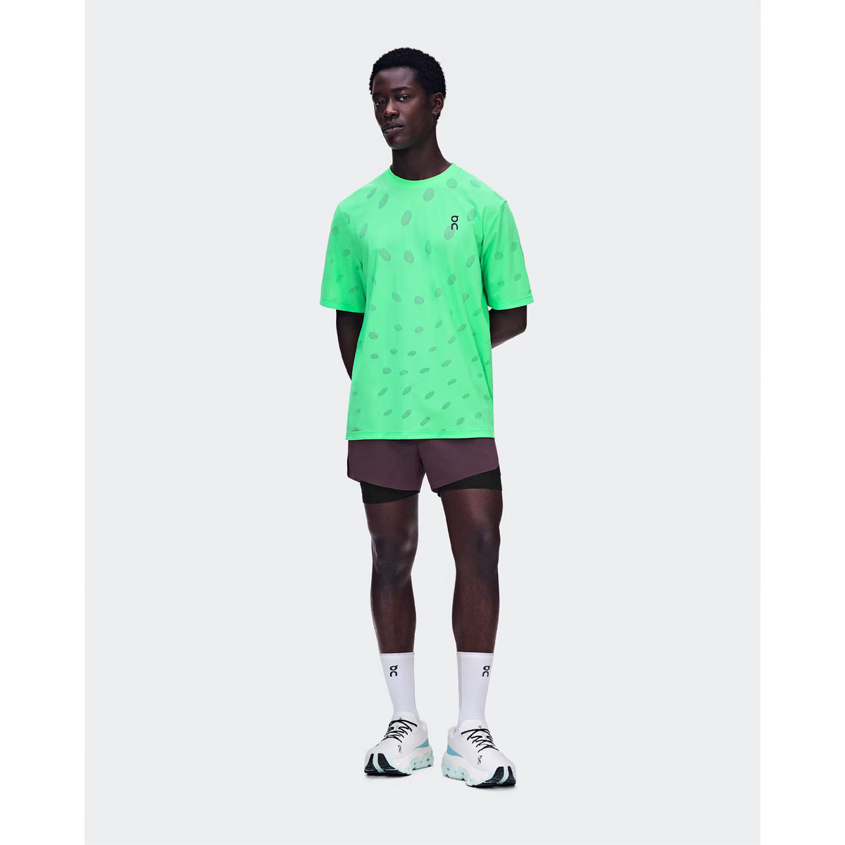 Men's On Zero 2-in-1 Shorts Urchin Black front full body view on male runner showing 2-in-1 construction with ultralight perforated outer and On DryTec moisture-wicking inner for high-performance training