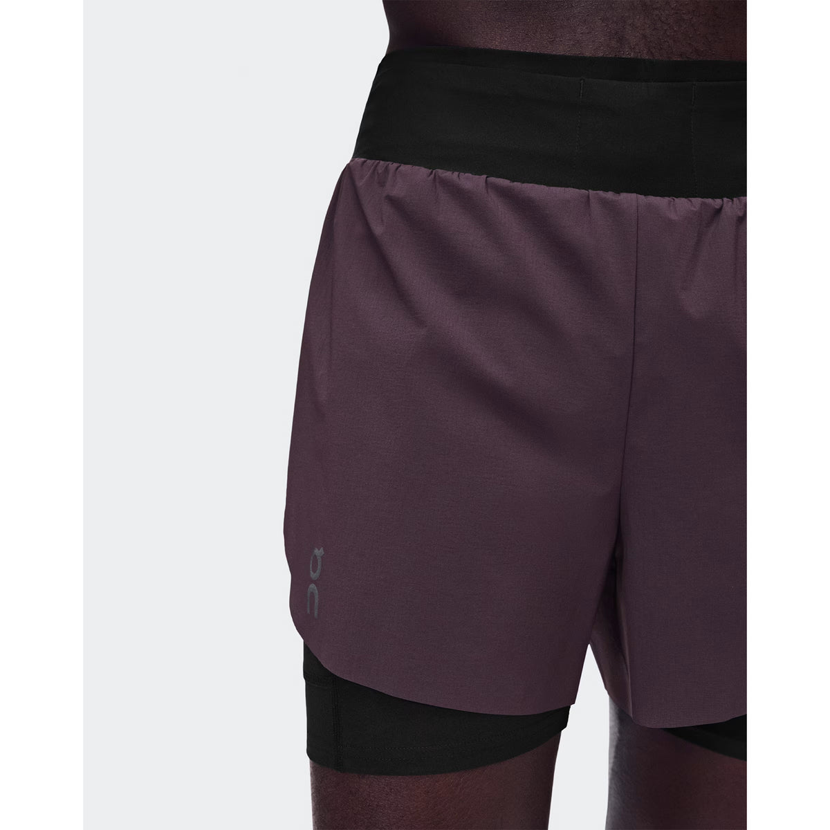 Men's On Zero 2-in-1 Shorts Urchin Black close-up of perforated outer showing ventilation construction for improved airflow during race pace and sustained training efforts