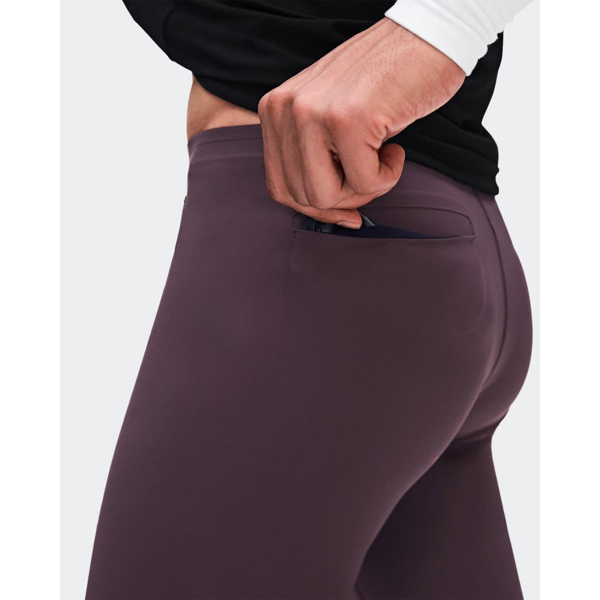Men's On Zero Half Tights Urchin close-up of engineered bonded back pockets showing flush secure storage for valuables and energy gels without bounce during race day and fast training