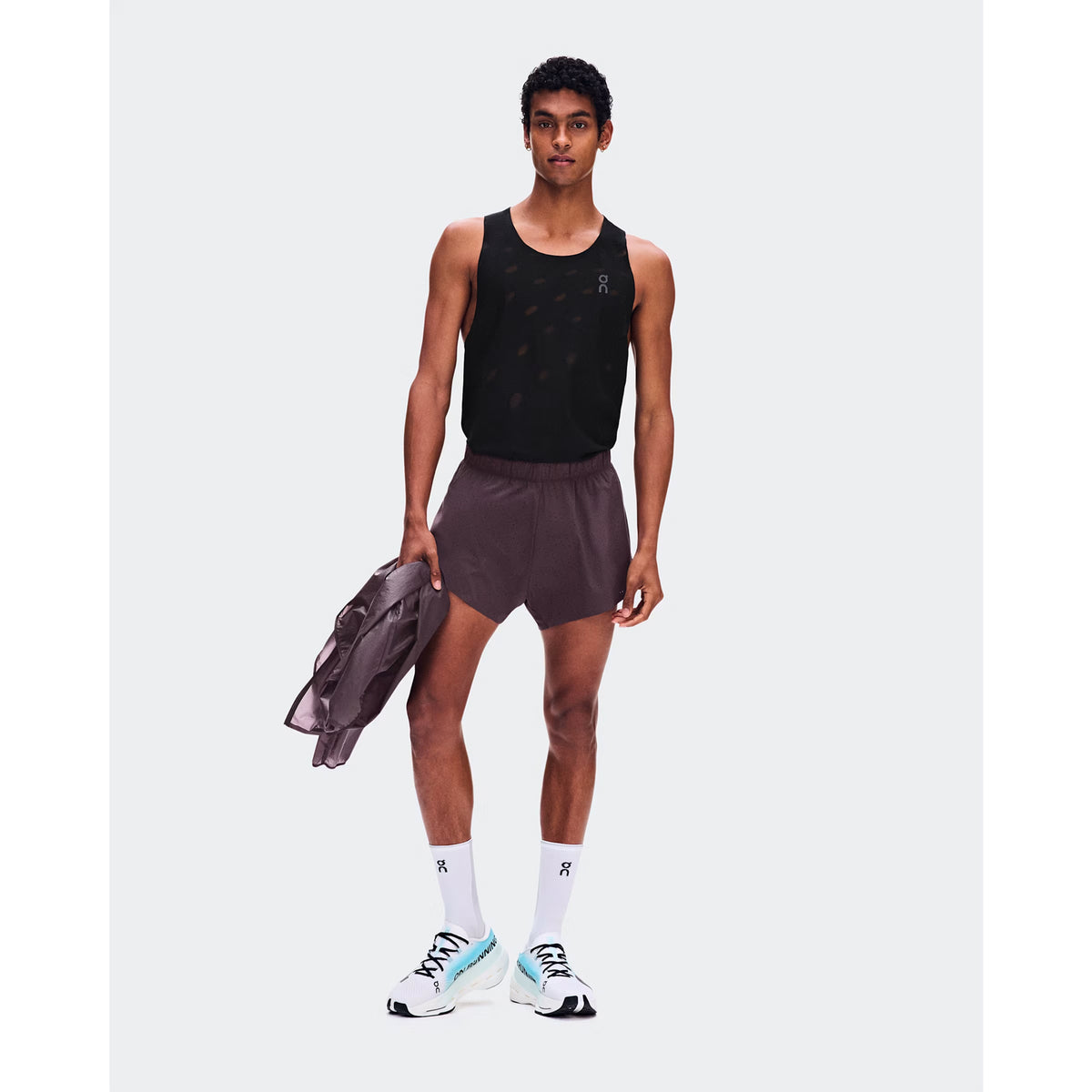 Men's On Zero Shorts Urchin front full body view on male runner showing On athlete-inspired graphic with lightweight perforated construction and adjustable waistband for race day and fast training