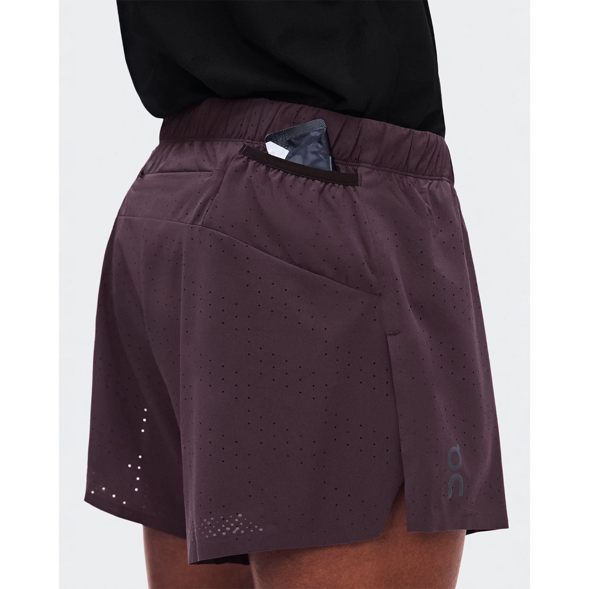 Image 10 - Gel pocket closeup:
"Men's On Zero Shorts Urchin close-up of gel mesh pocket showing accessible race day nutrition storage with secure bounce-free design for distraction-free running and racing