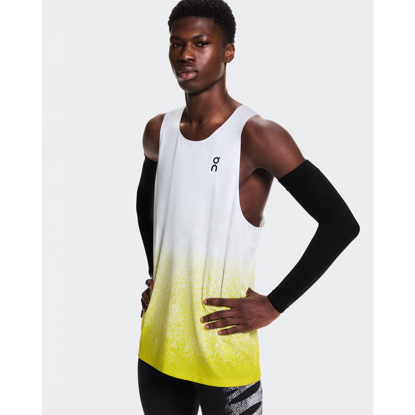 Men's On Zero Singlet White Yellow front view on male runner showing expressive graphic inspired by On athlete prints and race-ready fit