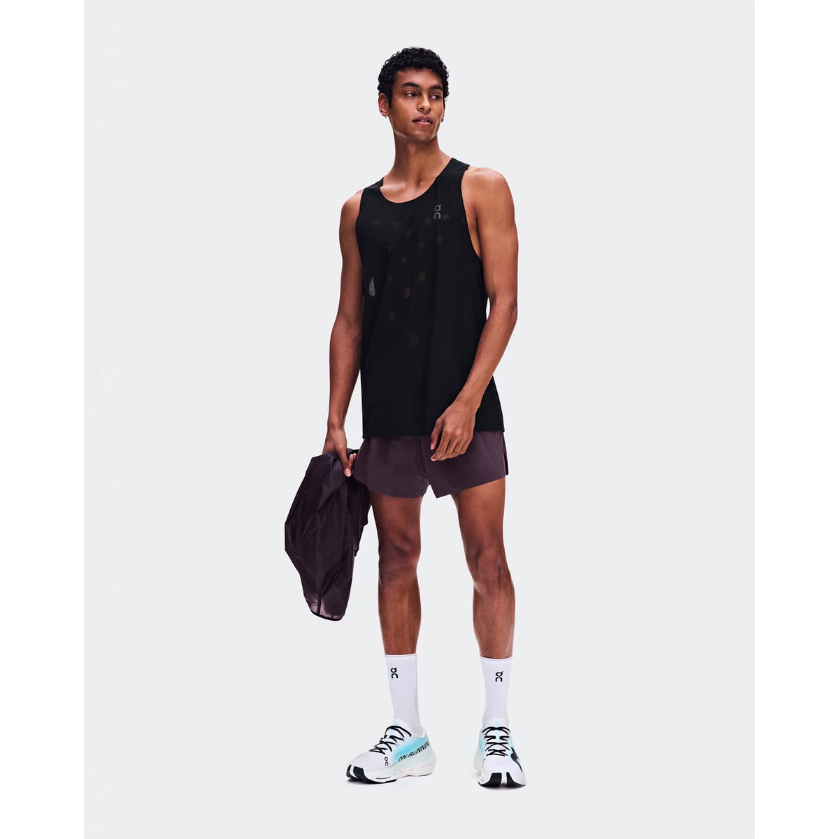 Men's On Zero Tank Breathe Black front full body view on male runner showing ultralight OAC-inspired jacquard tank with DryTec breathable construction for race day and fast training performance