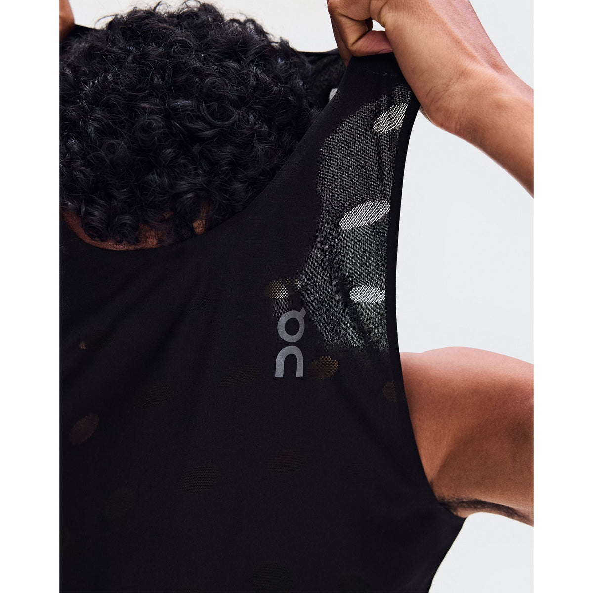 Men's On Zero Tank Breathe Black close-up of striking functional jacquard fabric showing On DryTec breathable moisture-wicking construction with minimal seams for ultralight distraction-free racing and training