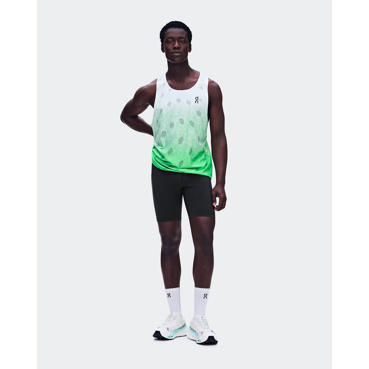 Men's On Zero Tank Breathe Verdite front full body view on male runner showing ultralight OAC-inspired jacquard tank with DryTec breathable construction for race day and fast training performance