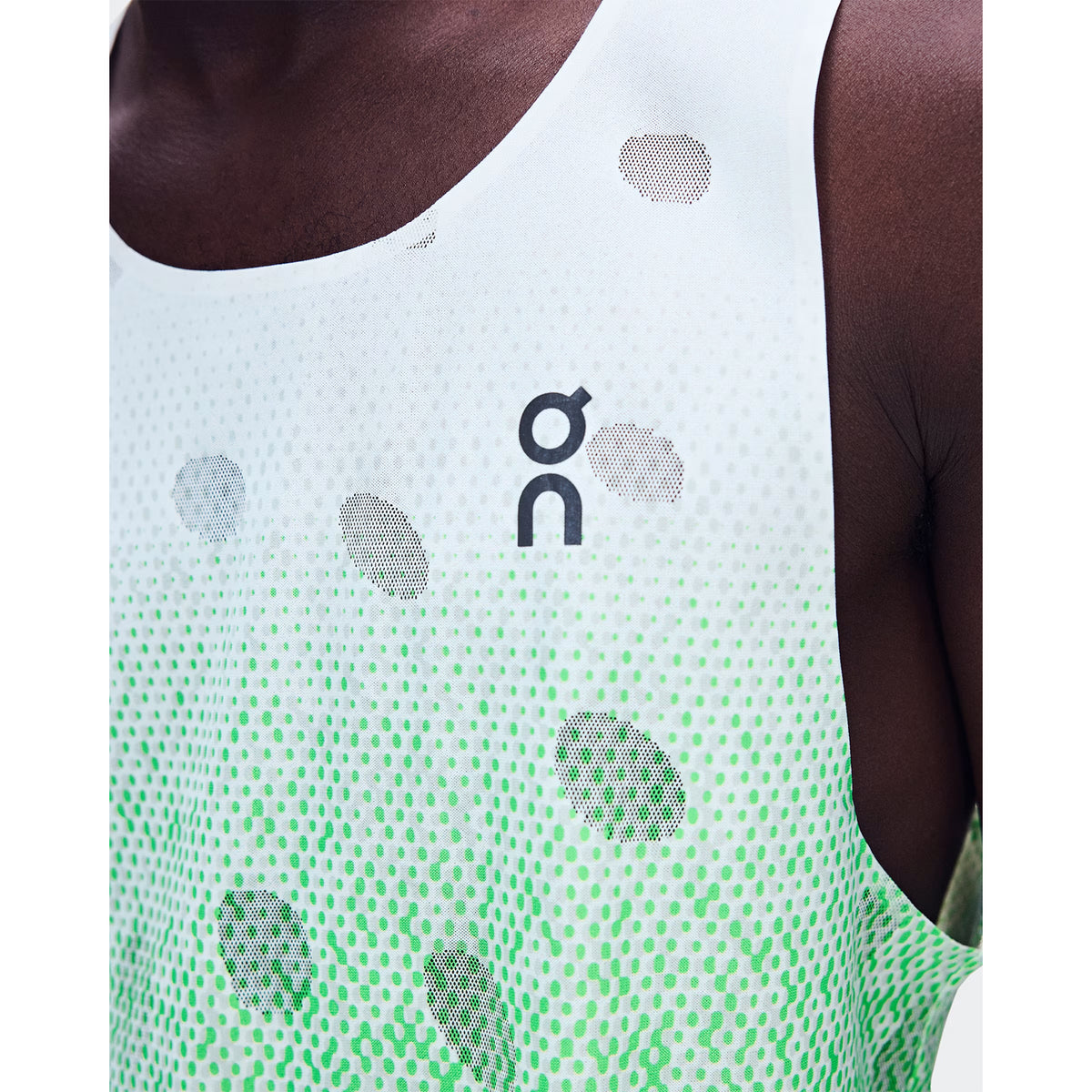 Men's On Zero Tank Breathe Verdite close-up of striking functional jacquard fabric showing On DryTec breathable moisture-wicking construction with minimal seams for ultralight distraction-free racing and training