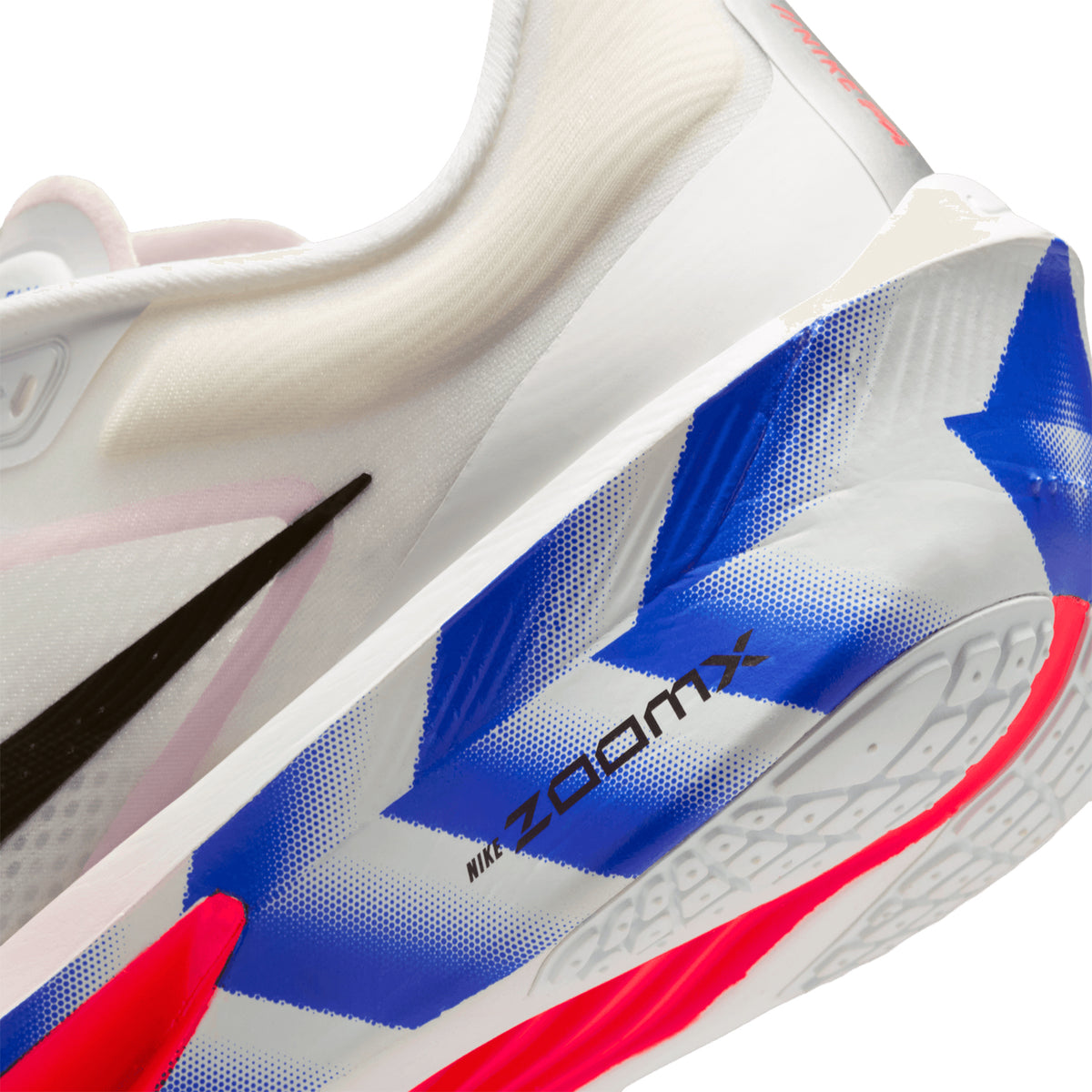 Nike Zoom Fly 6 men's running shoe in White / Silt Red / Racer Blue / Black — angled side view showing white synthetic leather upper, silt red and racer blue accent detailing and ZoomX carbon fibre plate midsole stack