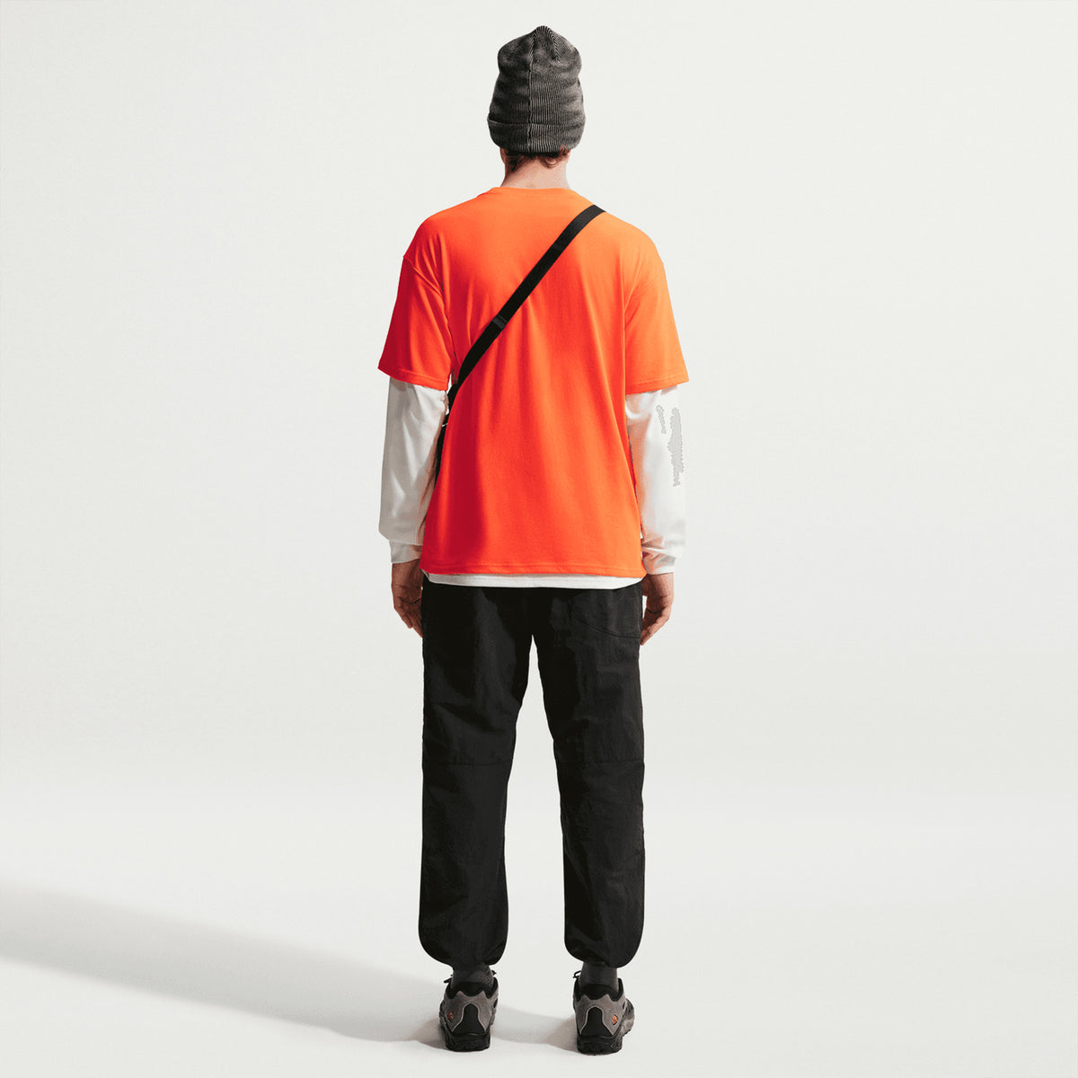 Nike Men's ACG Dolomiti Trousers Black Summit White full body back view on male model showing mountain-tested construction with internal Dolomiti patch