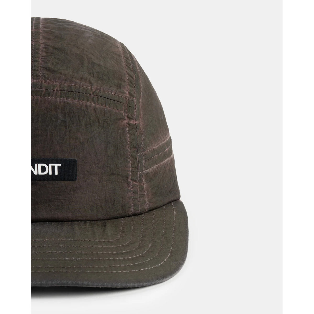 Bandit Nylon HumoFit Lunar Wash Run Hat Espresso close-up of front showing printed Bandit logo with silky nylon construction and branded taping detail