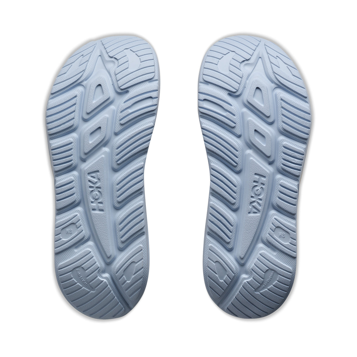 HOKA Ora Recovery Slide 3 Alabaster Ambient Blue sole view displaying injection-moulded EVA outsole for reliable grip on indoor and outdoor surfaces during recovery wear