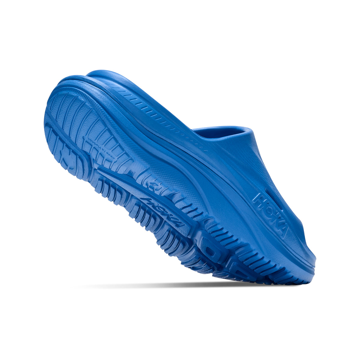 HOKA Ora Recovery Slide 3 Virtual Blue Virtual Blue angled side and heel view showing dual-density sugarcane EVA midsole with early stage MetaRocker and ventilated channels for foot-cradling post-run recovery comfort