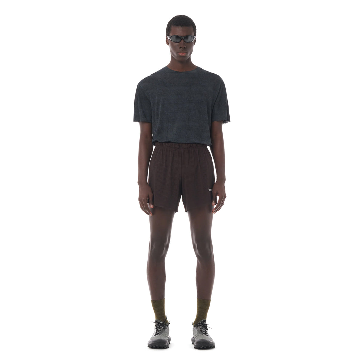 Satisfy Space-O™ 5 Inch Distance Shorts in Deep Mahogany — front view worn on model showing race-length 5" fit, laser punch-out perforated shell and stealth-reflective Satisfy logo