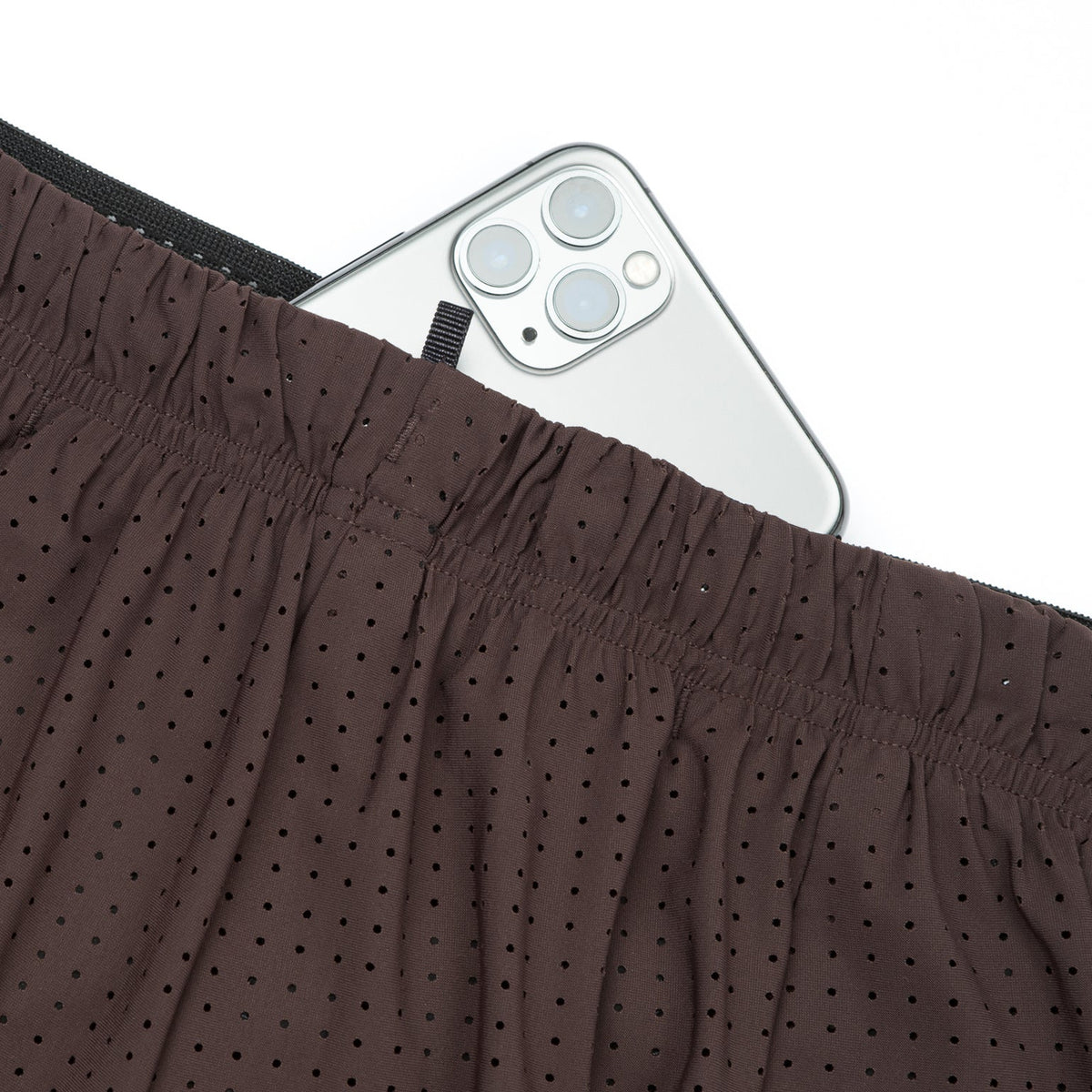 Satisfy Space-O™ 5 Inch Distance Shorts in Deep Mahogany — closeup showing sweat-resistant phone pocket hidden inside the double waistband construction