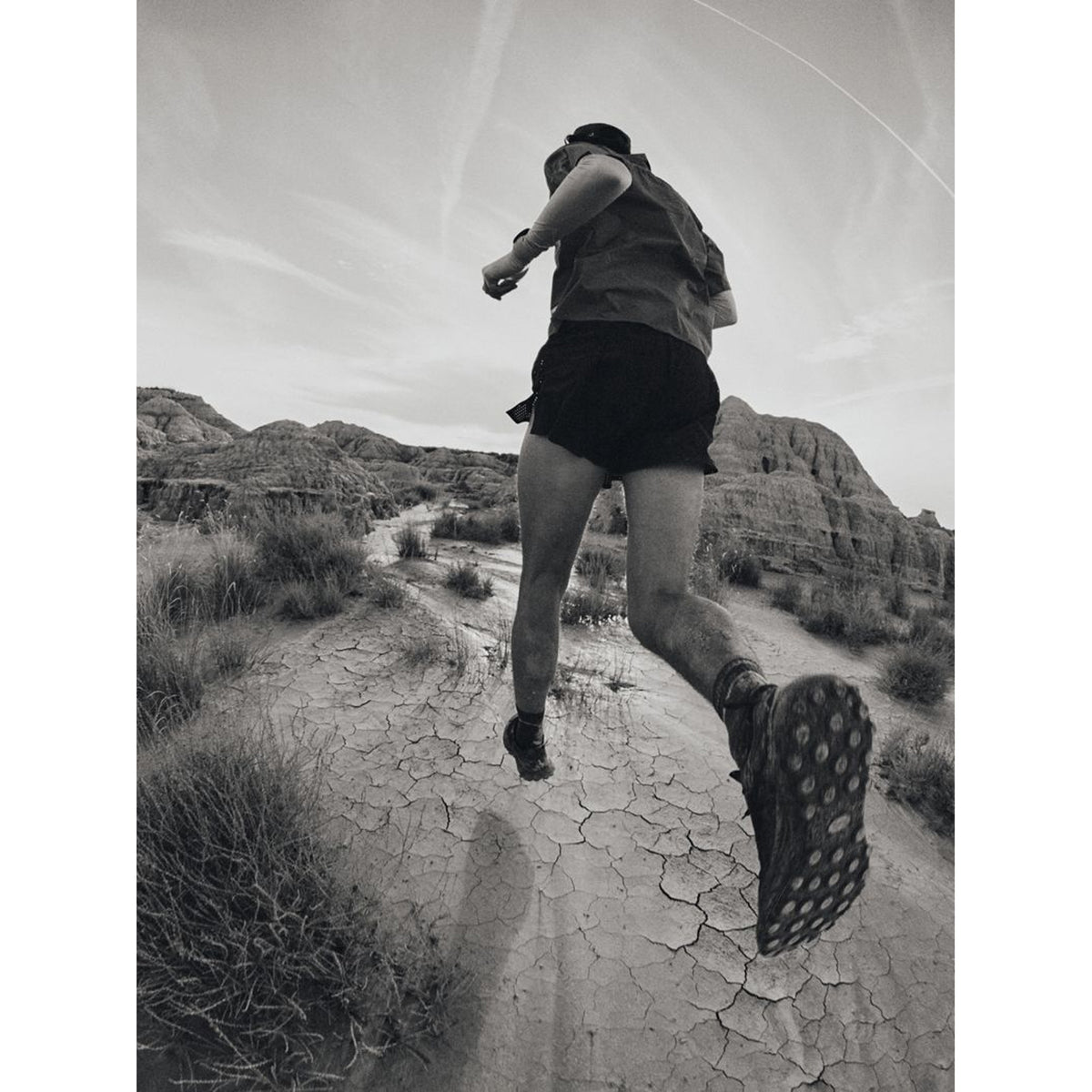 Satisfy TheROCKER Trail Running Shoes Jet Black worn by runner in motion showing mixed terrain capability and long-distance running form