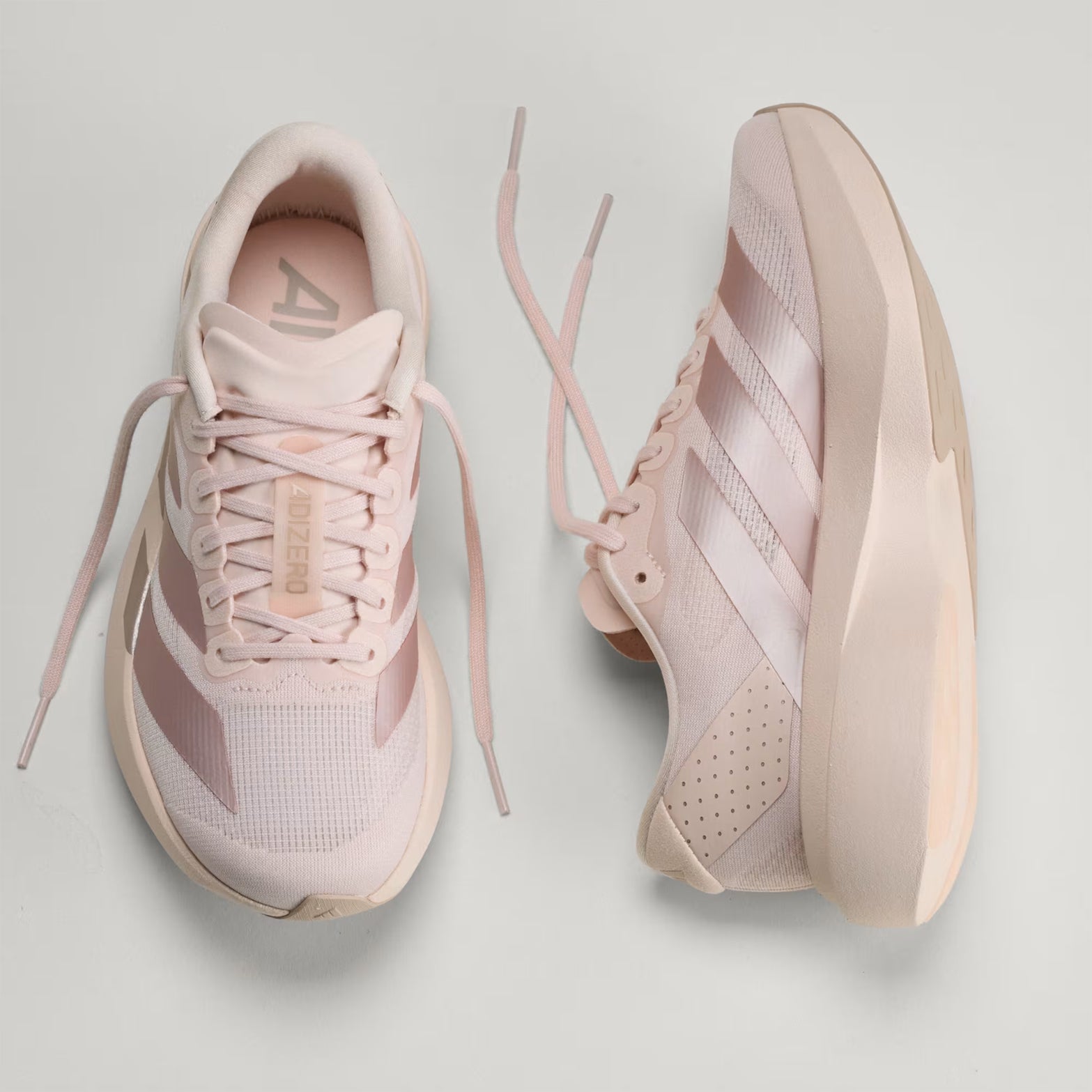 Women's adidas Adizero EVO SL Running Shoes Wonder Quartz Grey Wonder Taupe showing inner side view displaying LIGHTSTRIKE PRO cushioning with Continental rubber outsole alongside top view of synthetic textile upper with racing-inspired design for versatile running and lifestyle wear