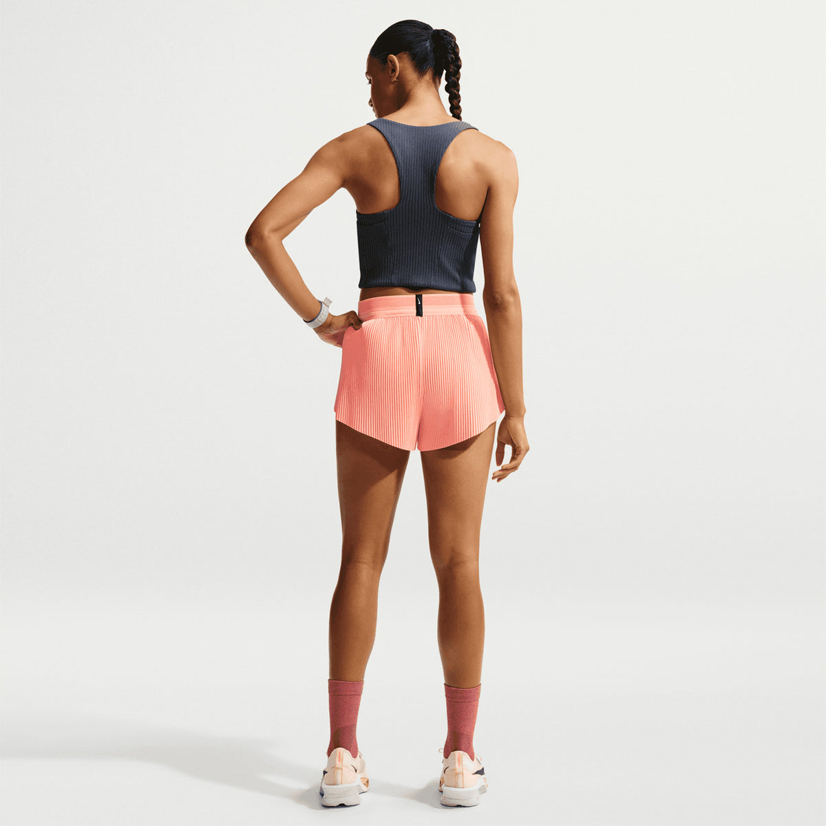 Women's Nike Aeroswift Dri-FIT ADV Cropped Running Tank Thunder Blue Linen back full body view on female runner showing drop-in gel pockets with Dri-FIT ADV moisture management and silky-smooth lined construction