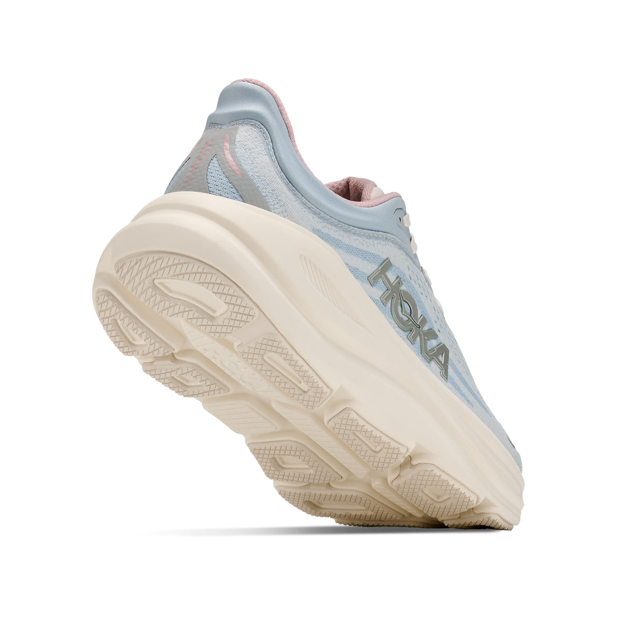 A light blue HOKA running shoe shown from a low angle, highlighting its thick, textured cream-colored sole and HOKA branding on the side.