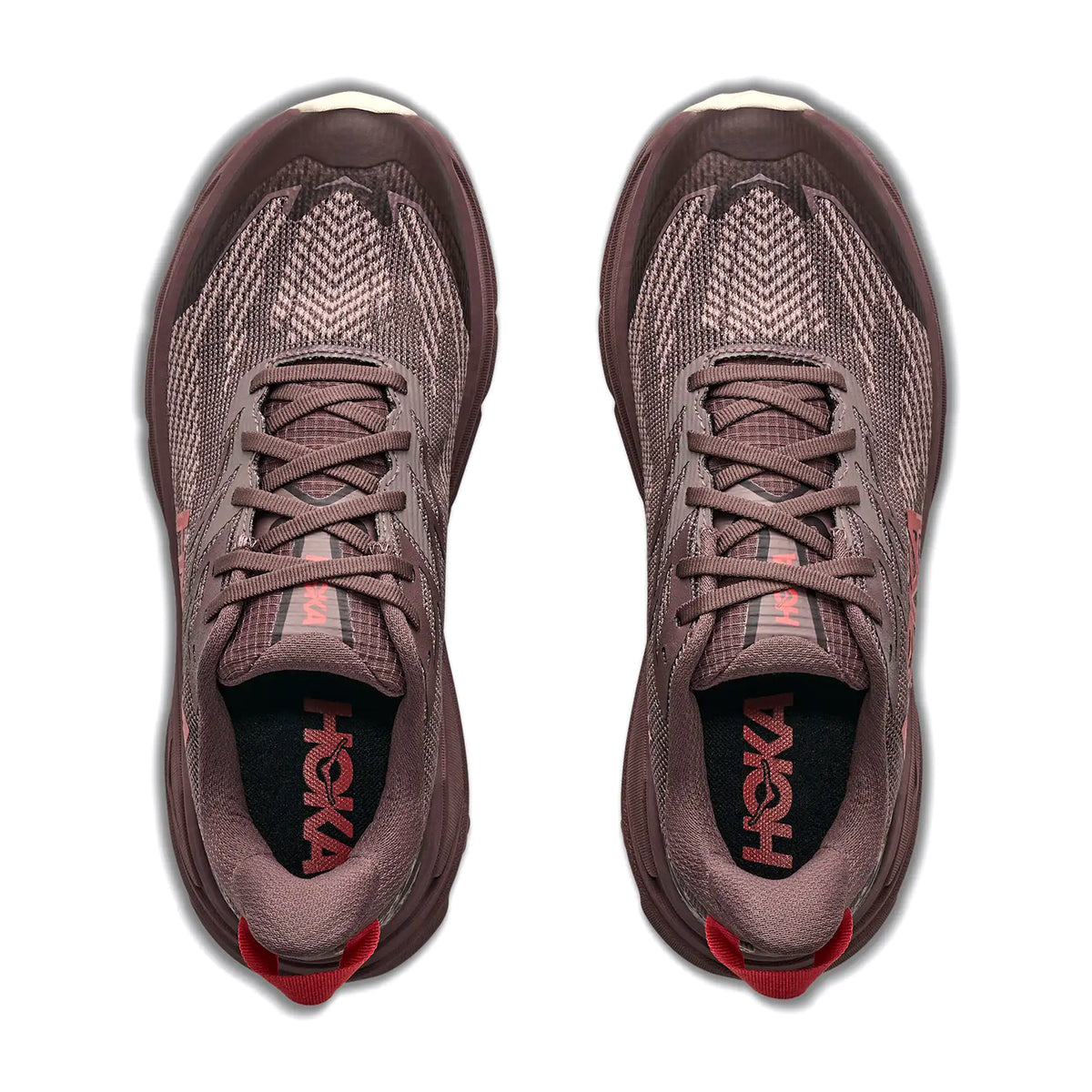 Top-down view of a pair of Women’s Challenger 8 GORE-TEX Trail Running Shoes Smokey Quartz / Alabaster, featuring mauve cushioned soles, dark laces, and pull tabs.