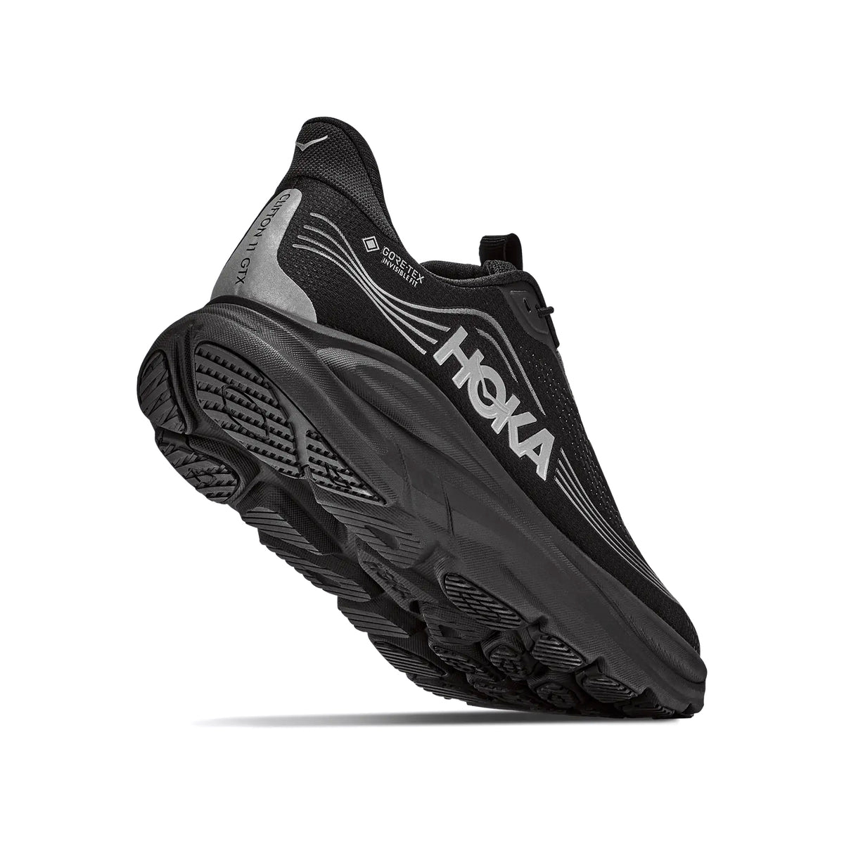 A black Hoka running shoe with a thick, textured sole and HOKA logo in white on the side, shown from a low angle against a white background.