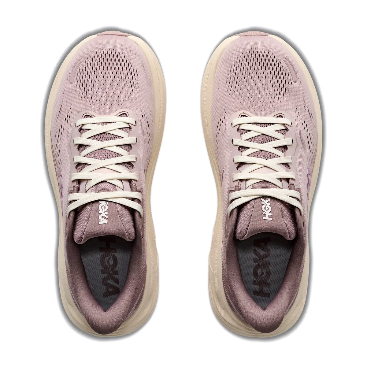 A pair of Hoka Women’s Clifton 11 Glimmers Running Shoes in Pink Opal / Quartzite, viewed from above, featuring white laces, breathable mesh uppers, beige soles, and a cushioning layer of compression moulded foam.