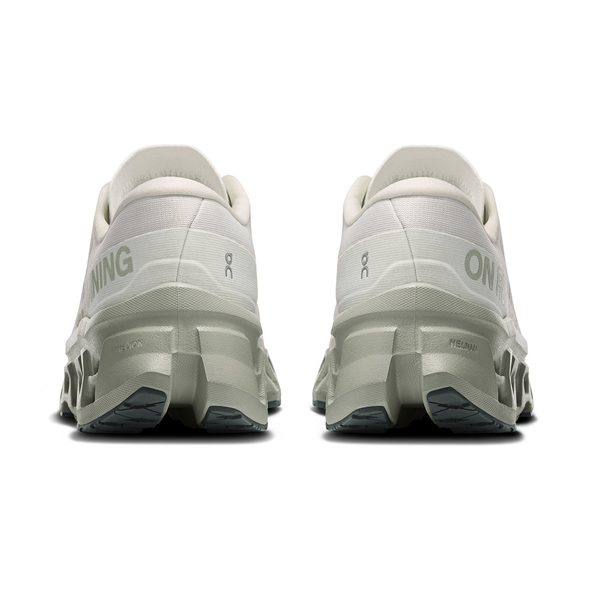 On Cloudmonster 3 women's running shoe in Ivory / Tin — heel view showing enhanced rocker heel geometry, padded collar and tin grey triple-layer CloudTec® midsole contrast