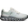 Introducing the Women’s Cloudrunner 2 Waterproof Running Shoes in Iceberg / Alloy by On. These white and grey athletic shoes feature a thick, cushioned sole with large holes and display the On brand logo on the side. Engineered with Helion™ superfoam for enhanced comfort and performance, these waterproof running shoes are designed to keep your feet dry on any terrain.