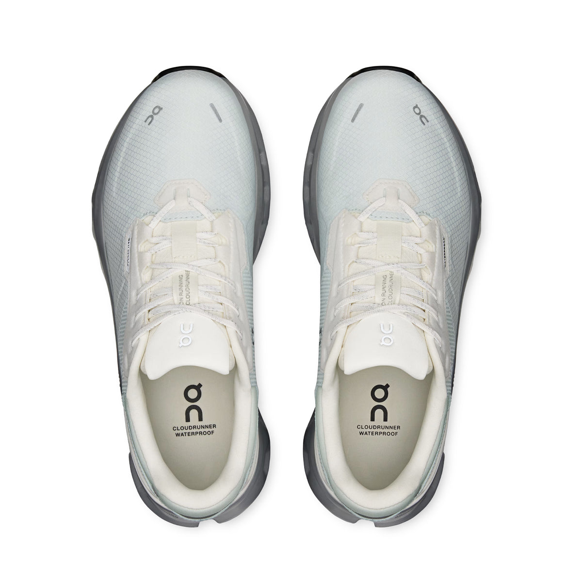 Top view of a pair of Women’s Cloudrunner 2 Waterproof Running Shoes in Iceberg / Alloy by On, featuring prominent On branding and “Cloudrunner Waterproof” text visible inside. Engineered with Helion™ superfoam for exceptional comfort, these reliable shoes offer waterproof protection for all-weather running performance.