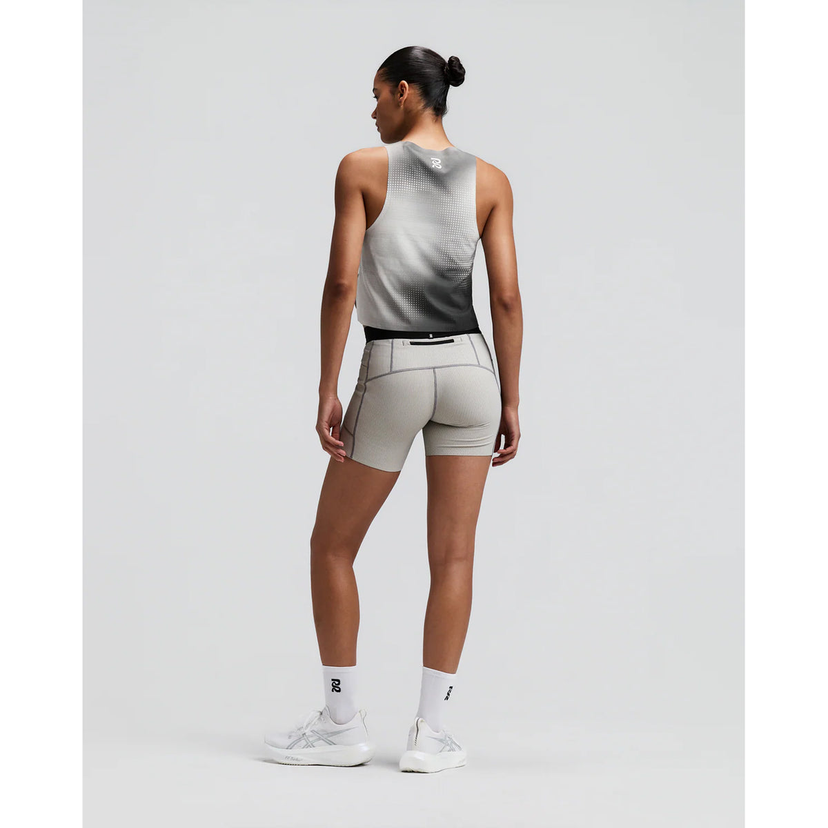 Women's Bandit CoolGrid Race Singlet Slate Multi back full body view on female runner showing bonded construction with side slits and two-tone reflective branding for breathable race day performance