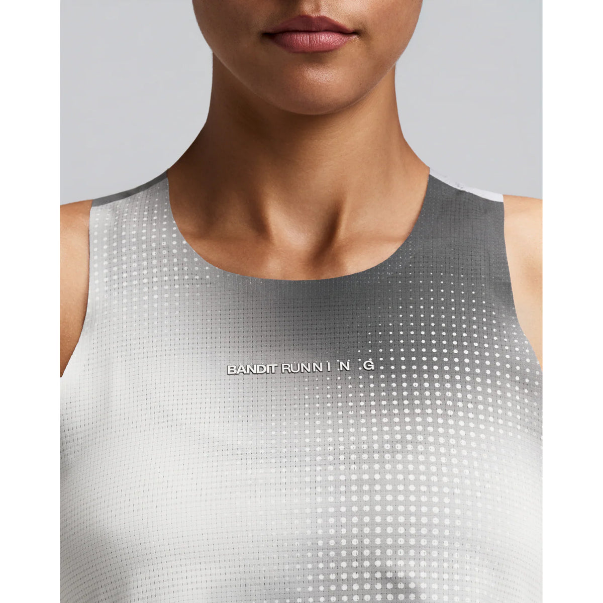 Women's Bandit CoolGrid Race Singlet Slate Multi close-up of front showing CoolGrid smooth breathable mesh with two-tone reflective Bandit branding and bonded seam construction