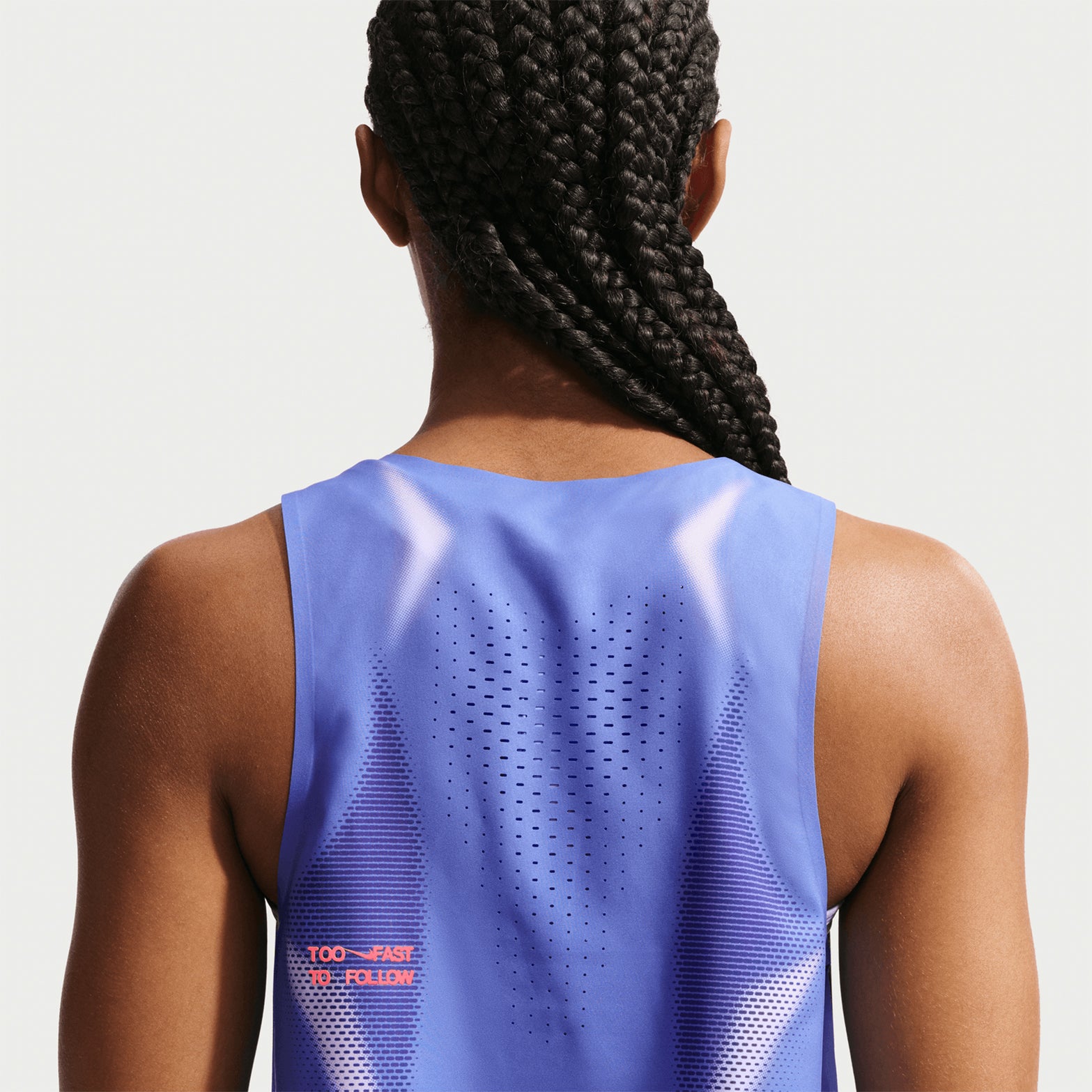 Women's Nike Dri-FIT ADV Cropped Running Vest Sapphire Hot Lava back view on female runner showing cropped construction with advanced sweat-wicking technology
