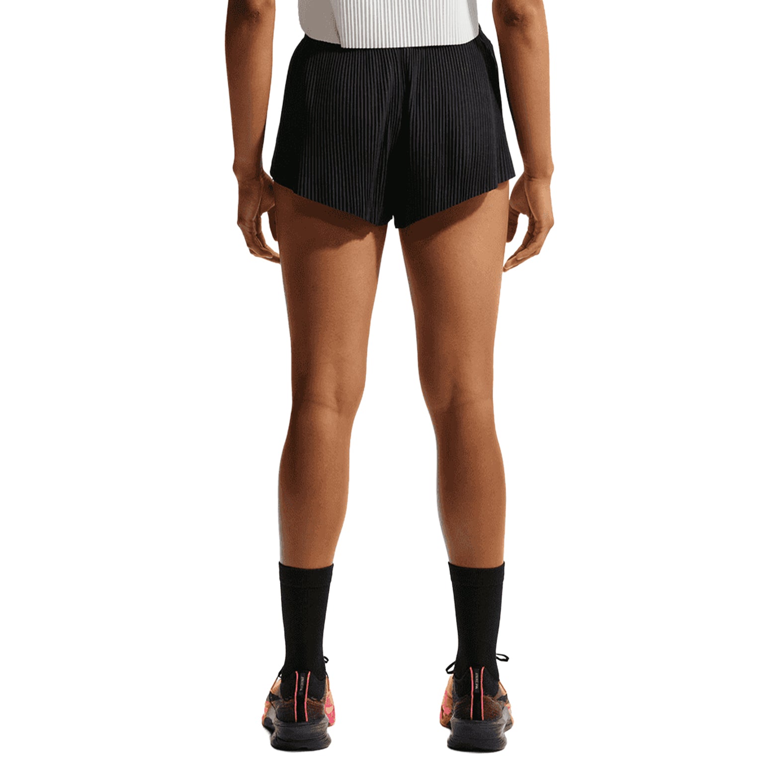 Women's Nike Dri-FIT AeroSwift ADV Mid-Rise 3 Inch Running Shorts Black White back view on female runner showing pleated back, split sides and updated brief liner