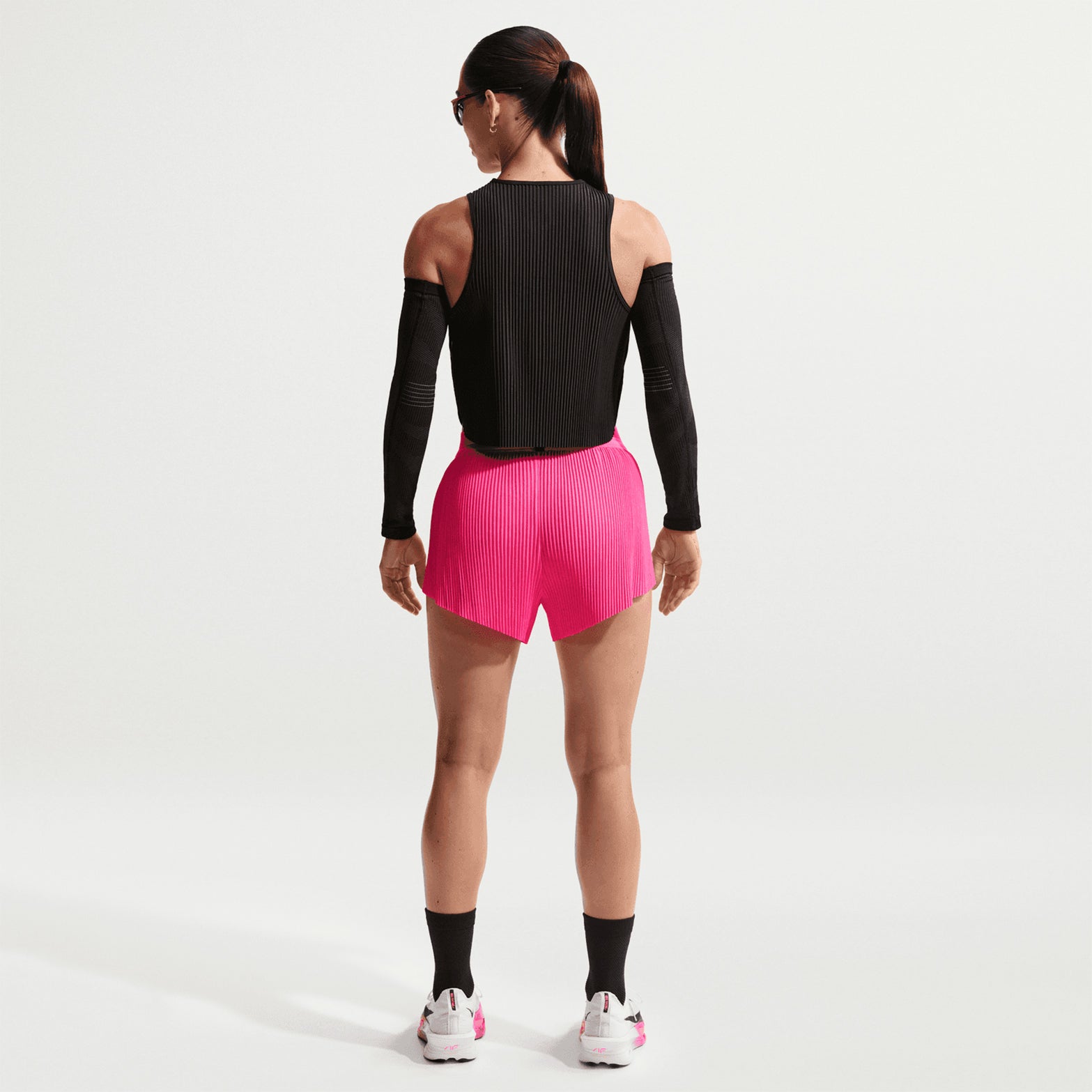 Women's Nike Dri-FIT Aeroswift ADV Mid-Rise 3 Inch Running Shorts Hyper Pink Black back full body view on female runner showing mid-rise construction with moisture-wicking fabric for comfortable running