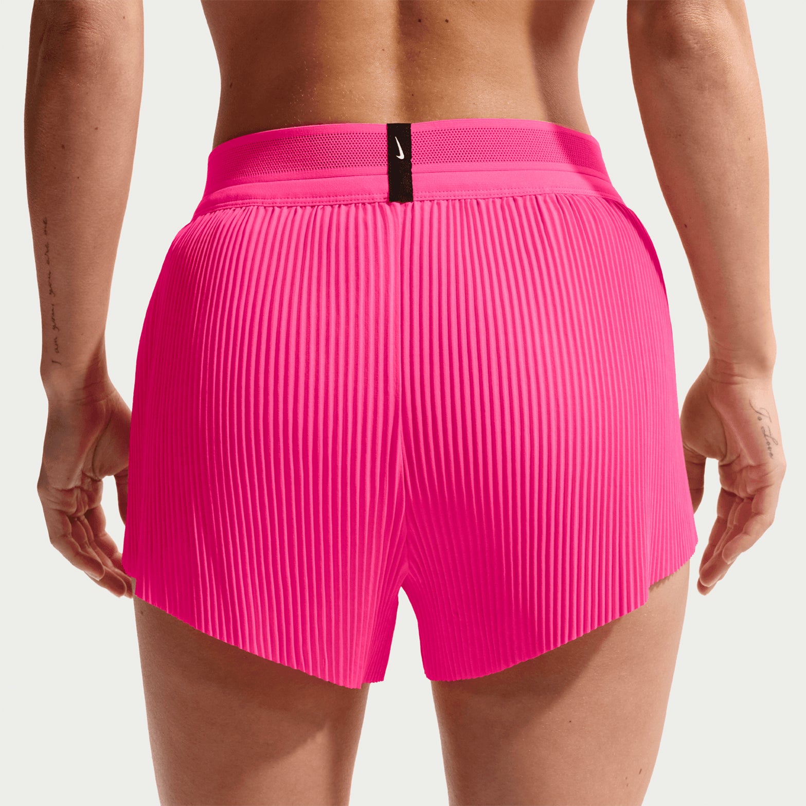 Women's Nike Dri-FIT Aeroswift ADV Mid-Rise 3 Inch Running Shorts Hyper Pink Black back view on female runner showing 3-inch inseam with breathable racing construction and moisture management