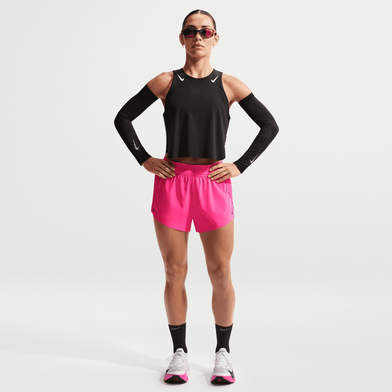 Women's Nike Dri-FIT Aeroswift ADV Mid-Rise 3 Inch Running Shorts Hyper Pink Black front full body view on female runner showing mid-rise 3-inch shorts with Dri-FIT ADV technology for training and racing
