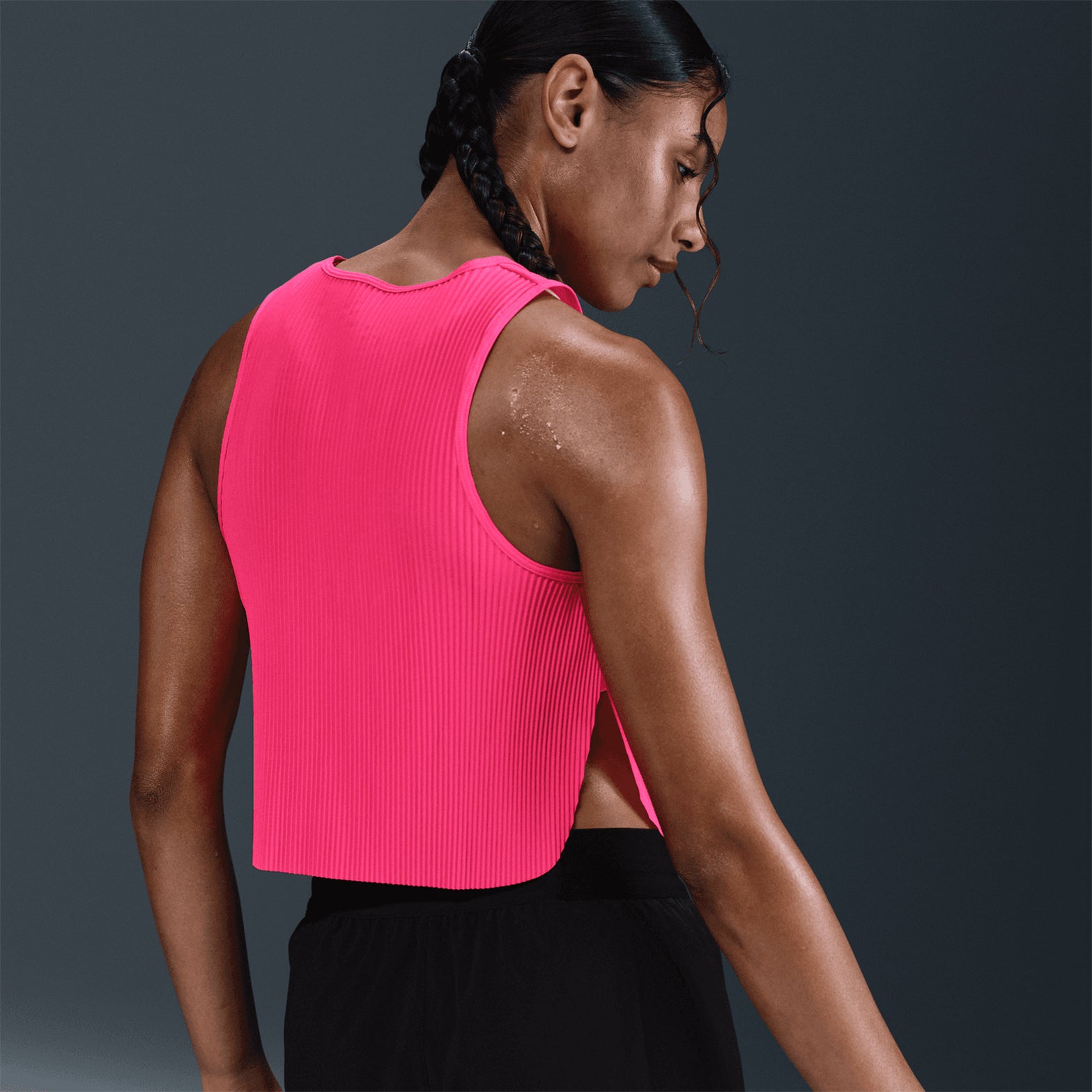 Nike AeroSwift women's Dri-FIT ADV cropped running tank in Hyper Pink / Black — back product shot showing hyper pink pleated back detail, black accent and lightweight Dri-FIT ADV moisture-wicking fabric