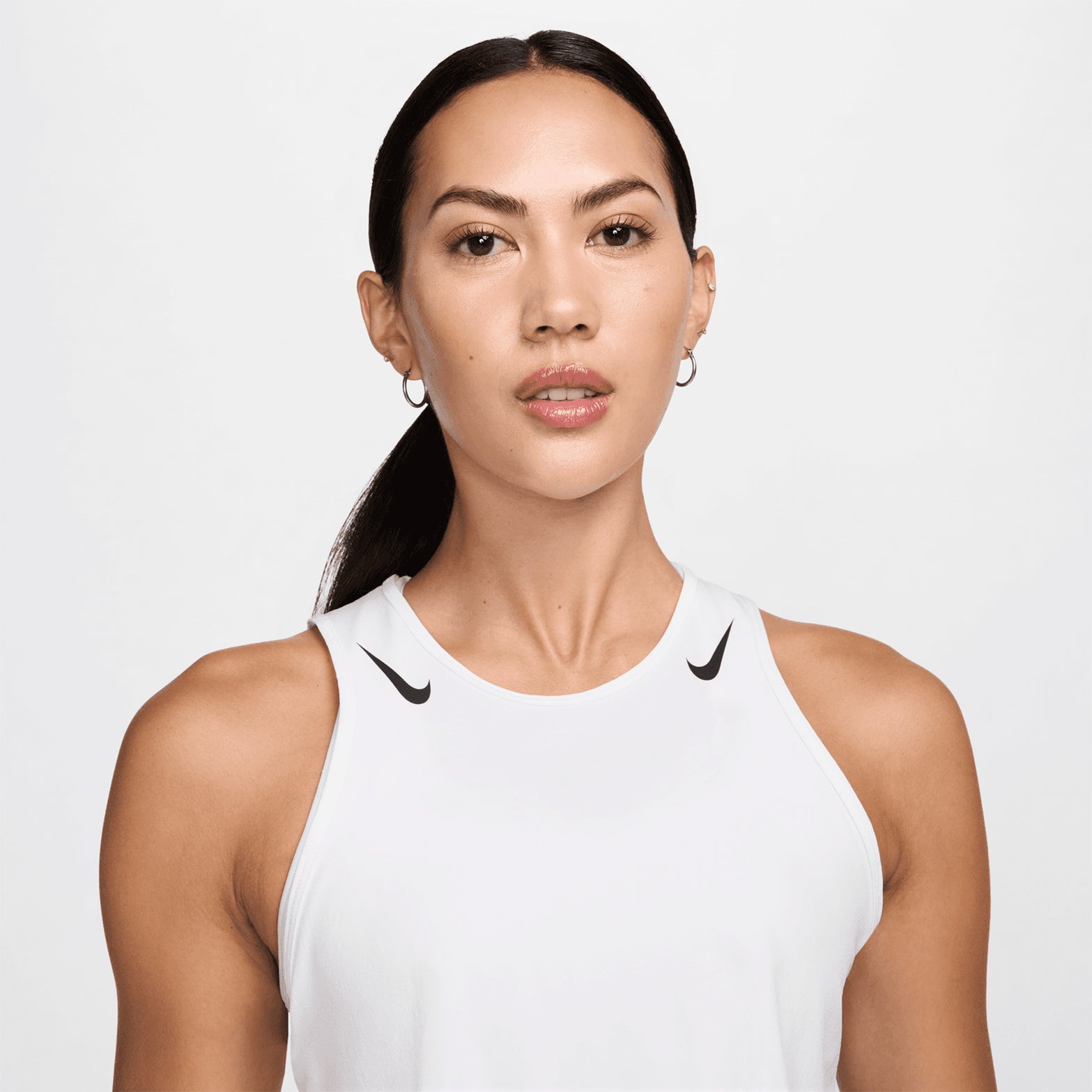 omen's Nike Dri-FIT AeroSwift ADV Running Tank White Black close-up front chest area showing Dri-FIT ADV moisture-wicking fabric and lightweight construction