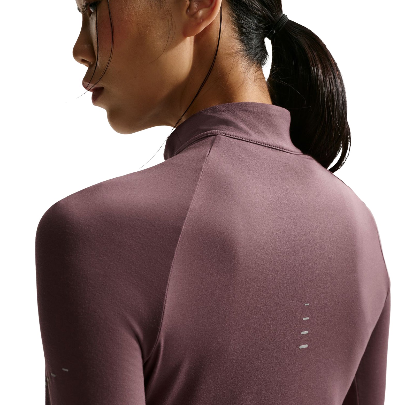 Nike Swift 1/4-zip running top Tattoo back closeup on model featuring reflective graphics and anti-chafe construction