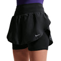 Women's Nike Flow Dri-FIT High-Waisted 2 in 1 Shorts Black front view on female runner showing flowing woven outer with exaggerated tulip hems and wide knit high-waisted waistband for comfortable daily running