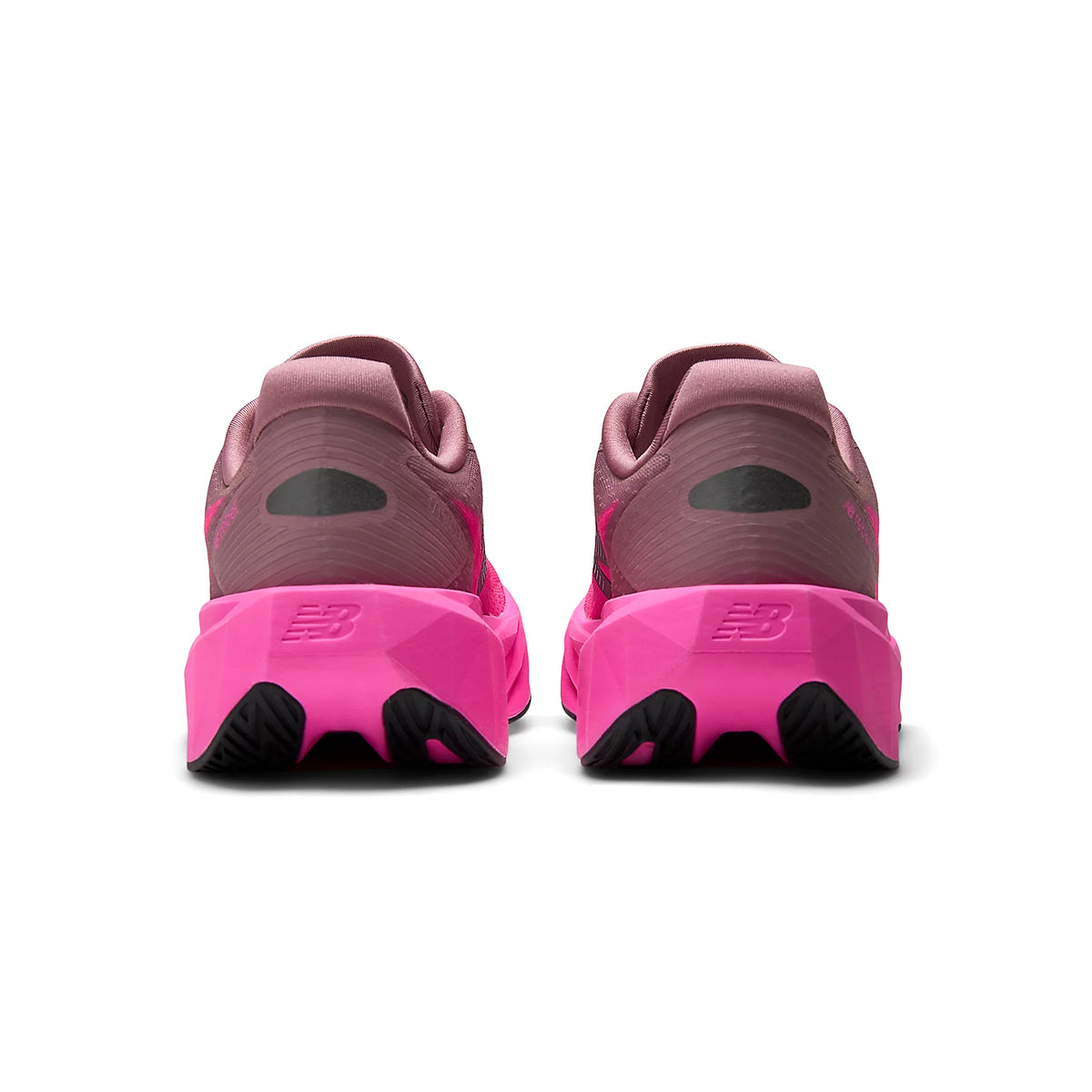 New Balance FuelCell Rebel v5 women's running shoe in Pink Heat / Rosewood — heel view showing redesigned heel construction, reflective detailing and rosewood geometric FuelCell midsole contrast