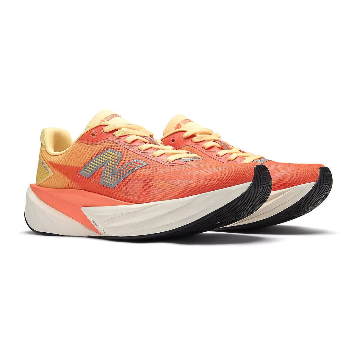 Women's New Balance FuelCell Rebel v5 Running Shoes Orange Grey angled side view showing amplified FuelCell cushioning, bold geometric midsole and incredibly lightweight construction