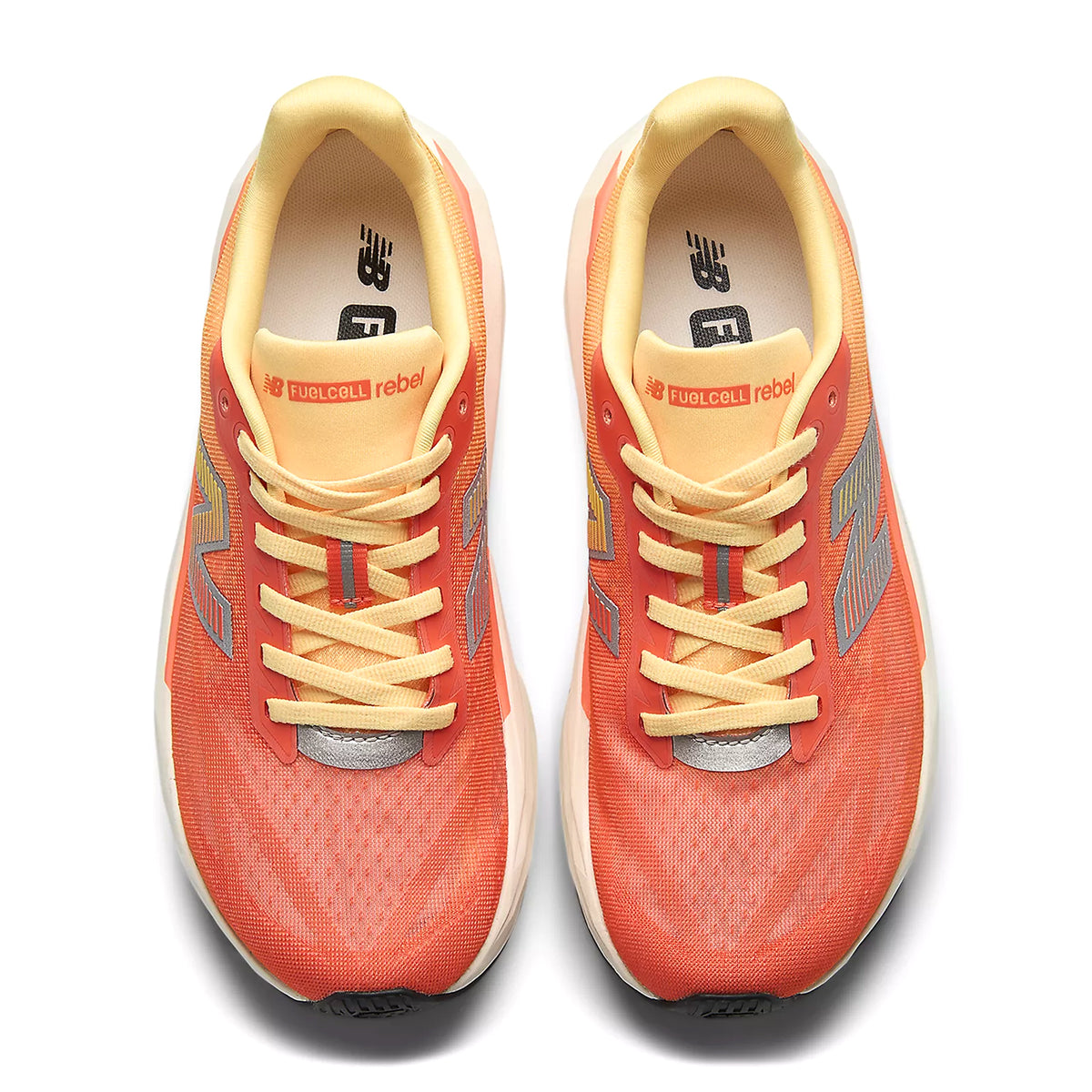 Women's New Balance FuelCell Rebel v5 Running Shoes Orange Grey top view showing streamlined race-inspired mesh upper with redesigned tongue and reflective detailing